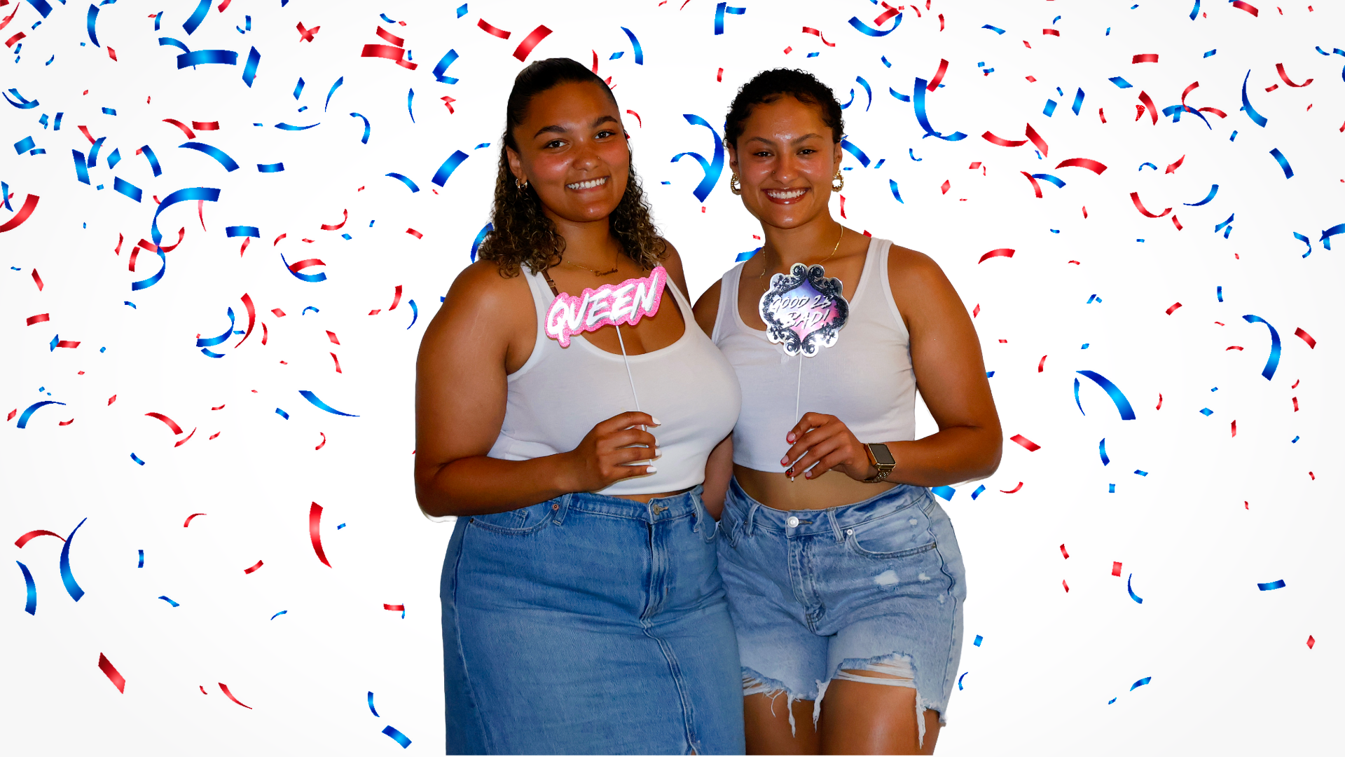 girls posing in 4th of july photo booth