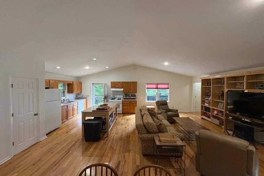 The open living room and kitchen of the farm house