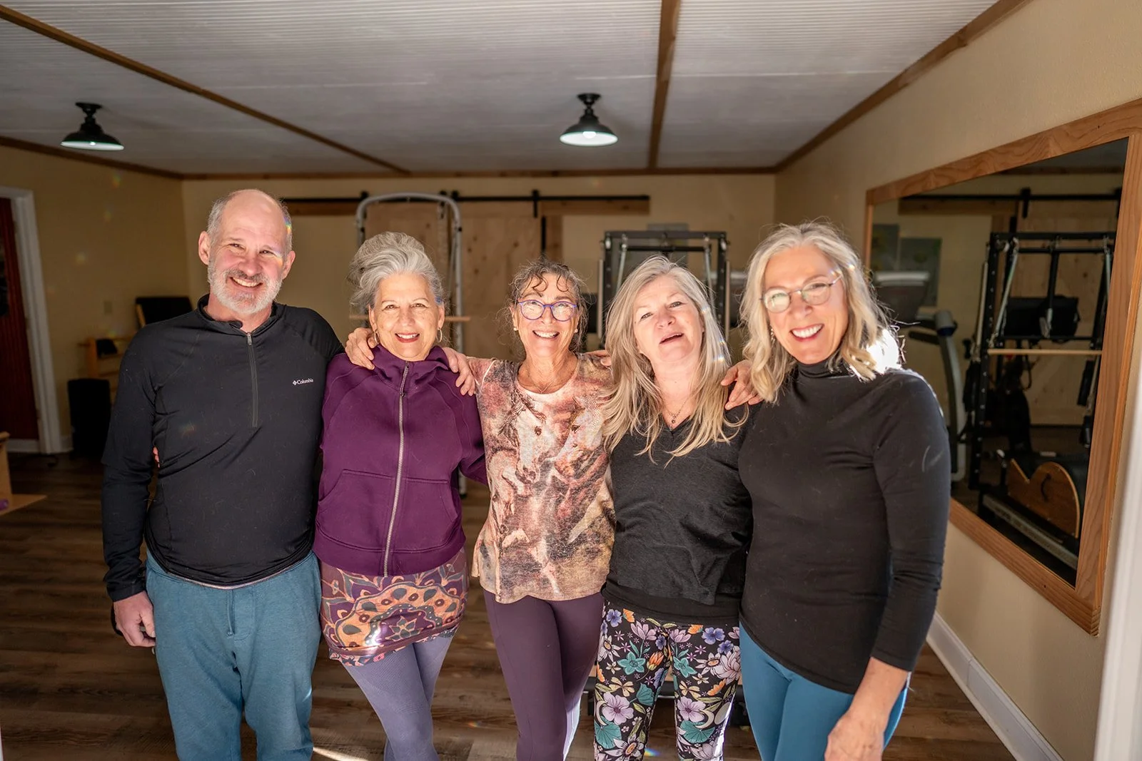 Kyra with a group of clients in her studio
