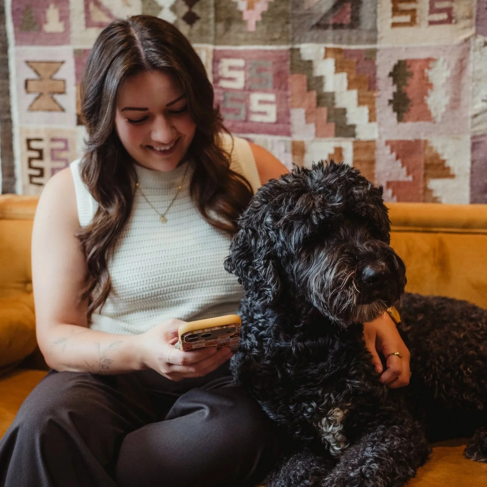 person smiling at phone
