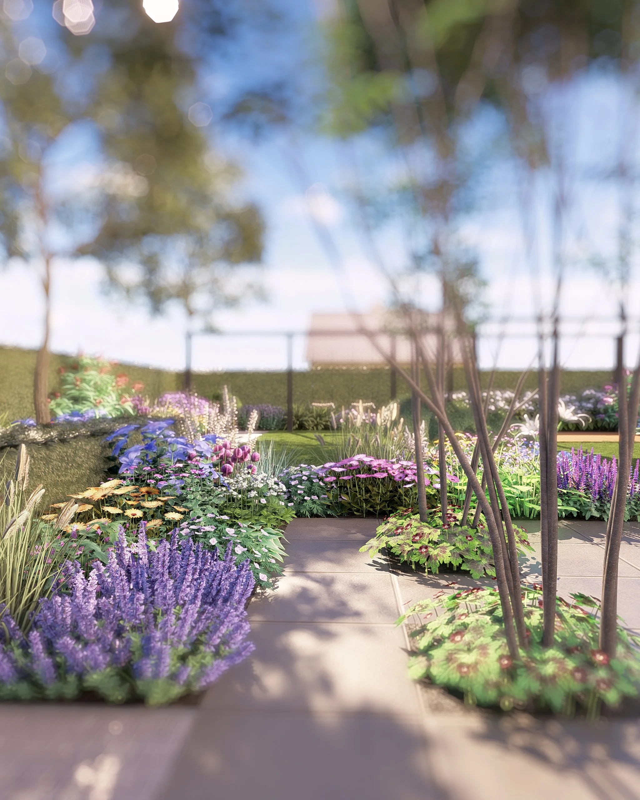 een tuin met kleurrijke bloemen, bomen en een betonnen pad op een zonnige dag