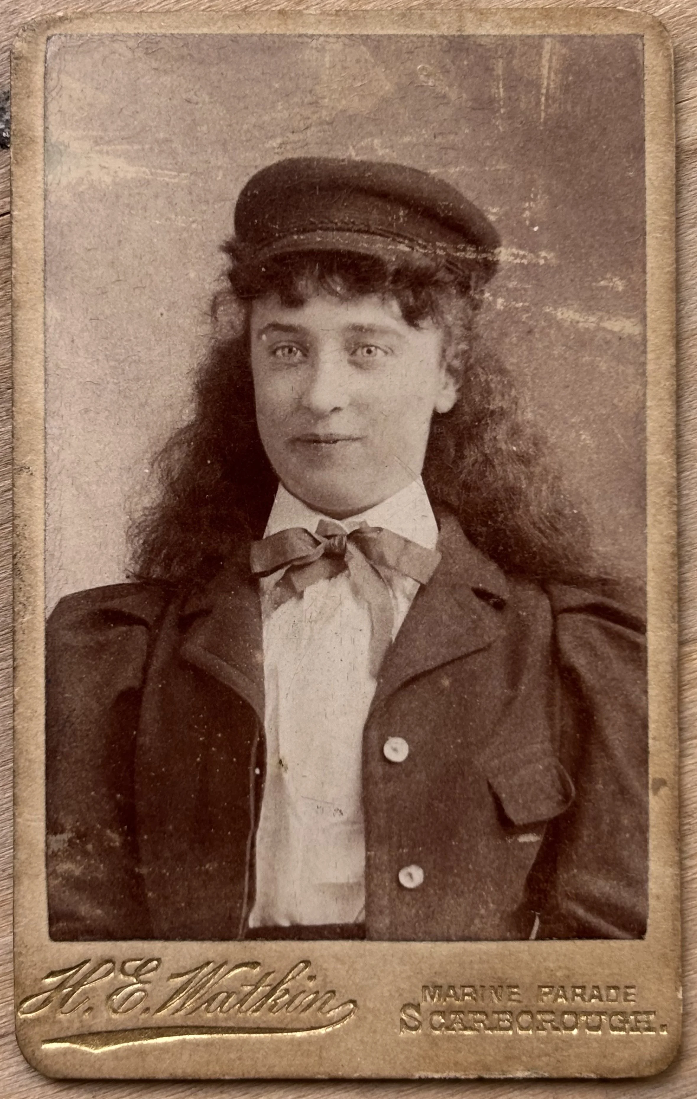 small carte de visite portrait of a woman in a cap by Scarborough photographer Herbert Watkin