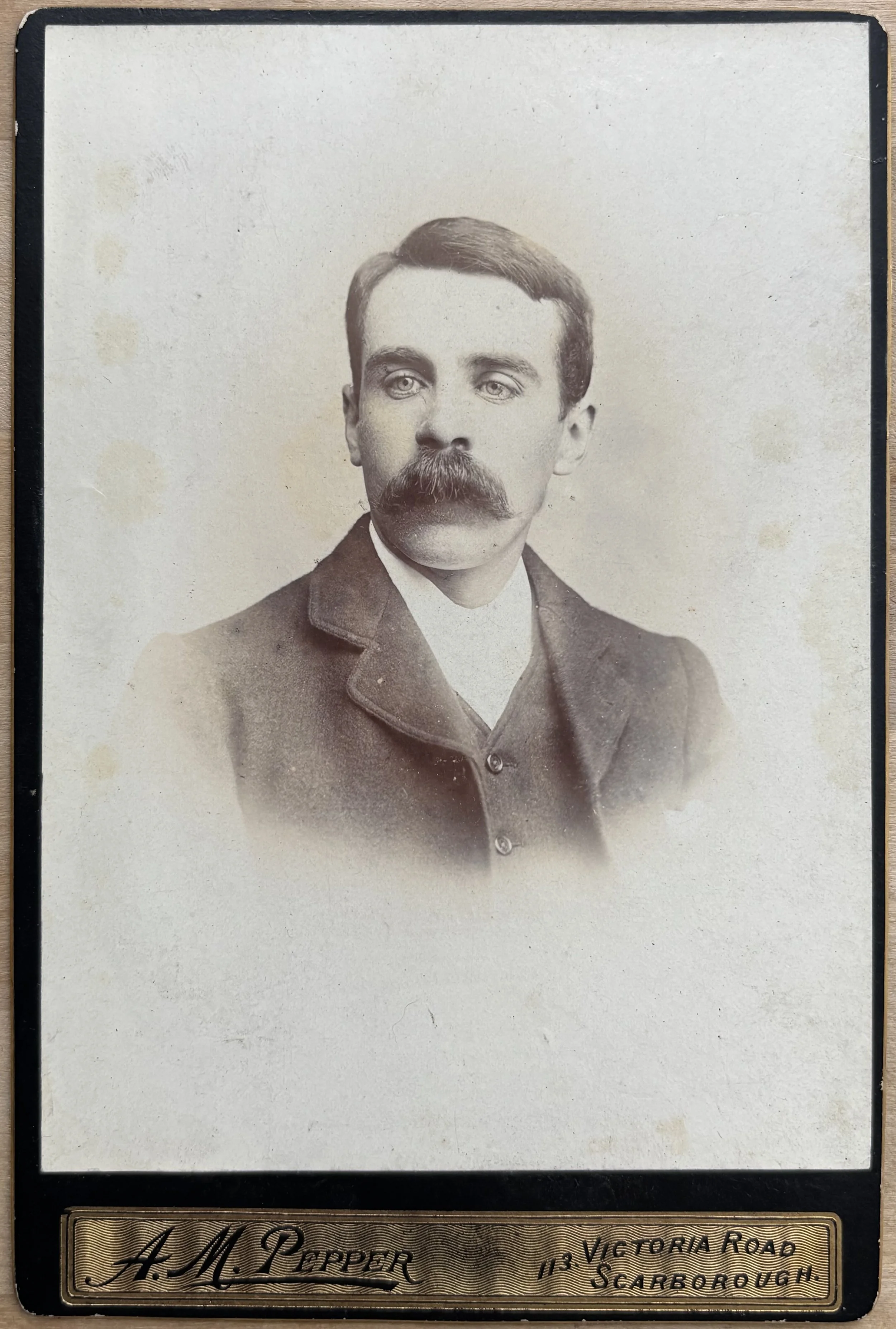 portrait of an unknown man with a bushy moustache by Scarborough photographer, Alfred Moore Pepper, Cabinet card