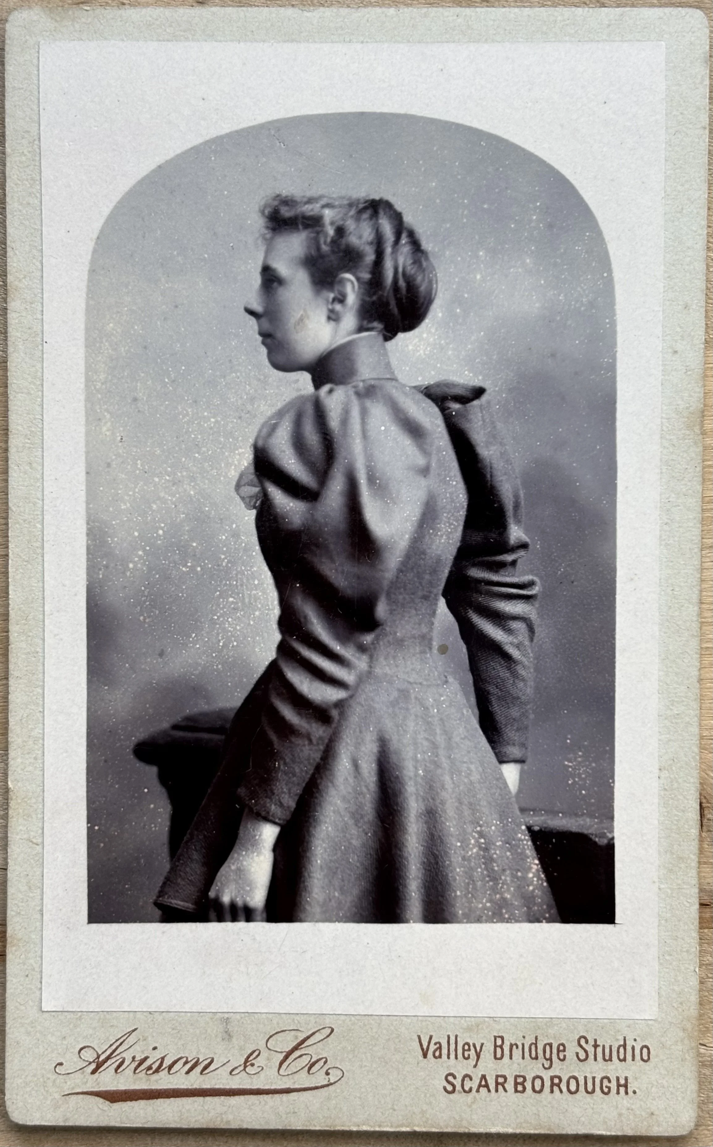 portrait of a woman turning away by Edwin Avison and co, Scarborough photographers Avison