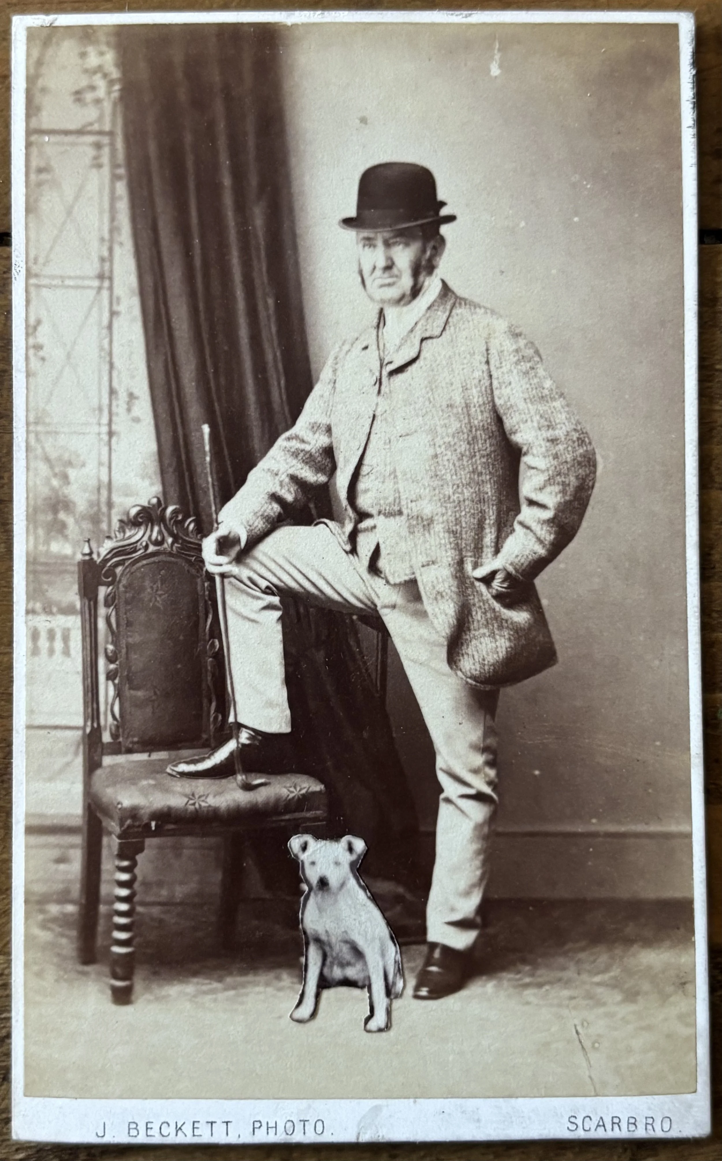 carte de visite portrait of a  man with bowler hat, cane and dog that has been added later, early photoshop, by Scarborough Photographer John Beckett