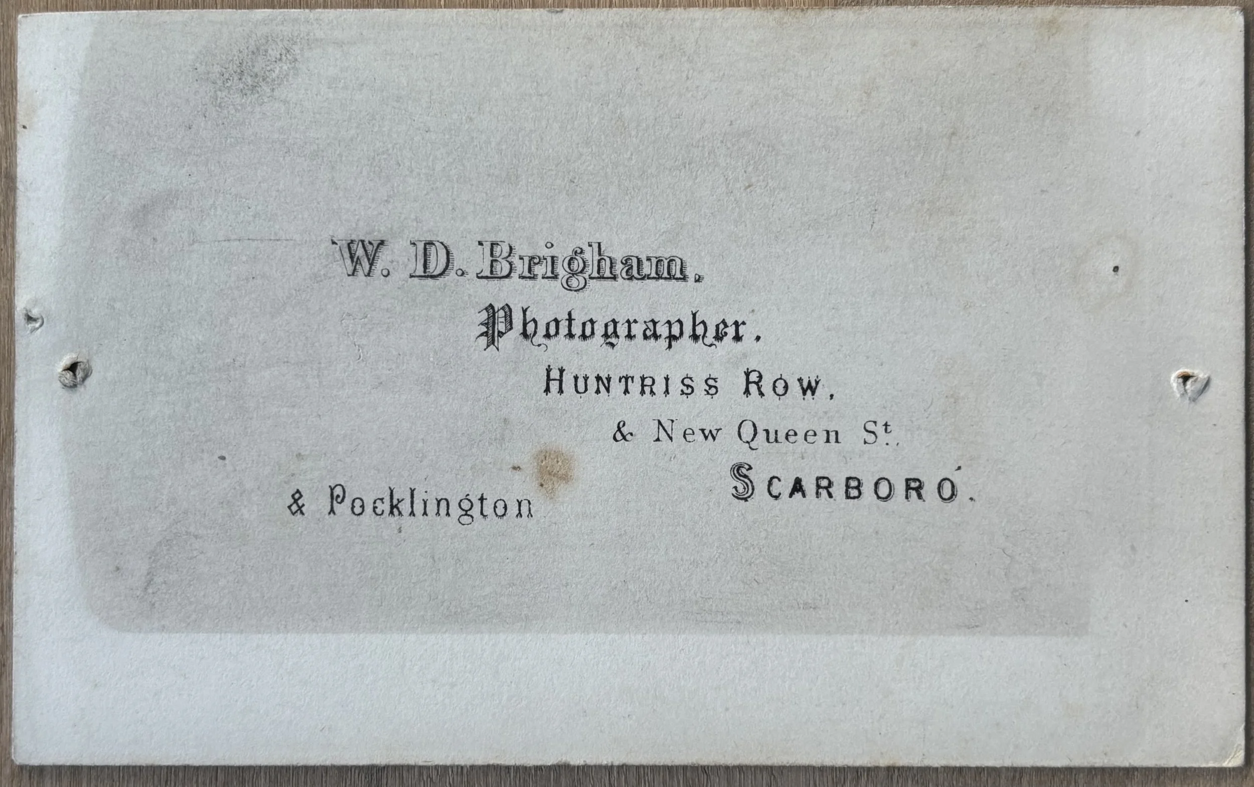 Back of carte de visite portrait of 2 men and a dog by William Dobson Brigham of Scarborough and Pocklington