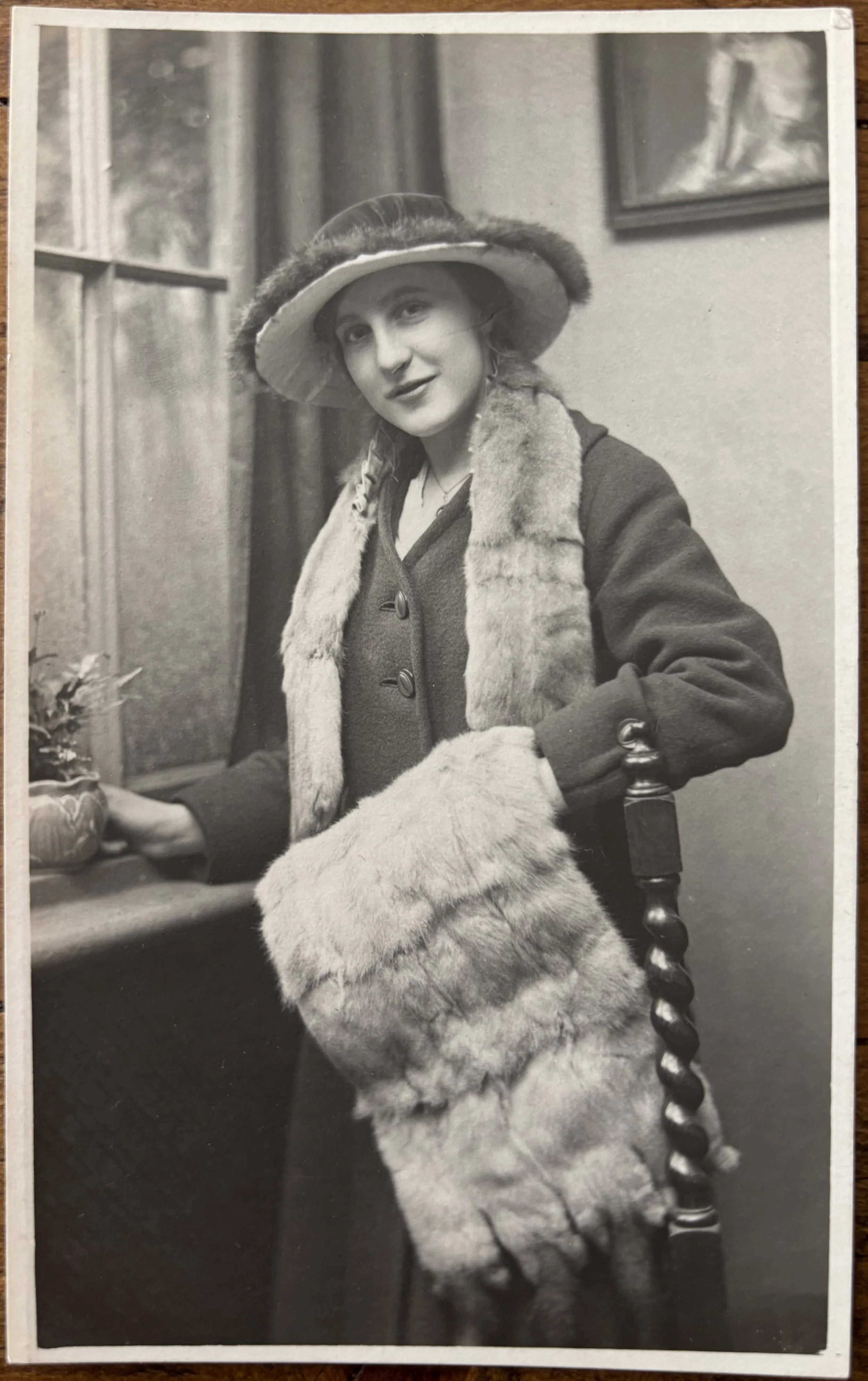 Portrait of a woman with a fur muff, neckpiece and trimmed hat, by Walkers Scarborough Photographer