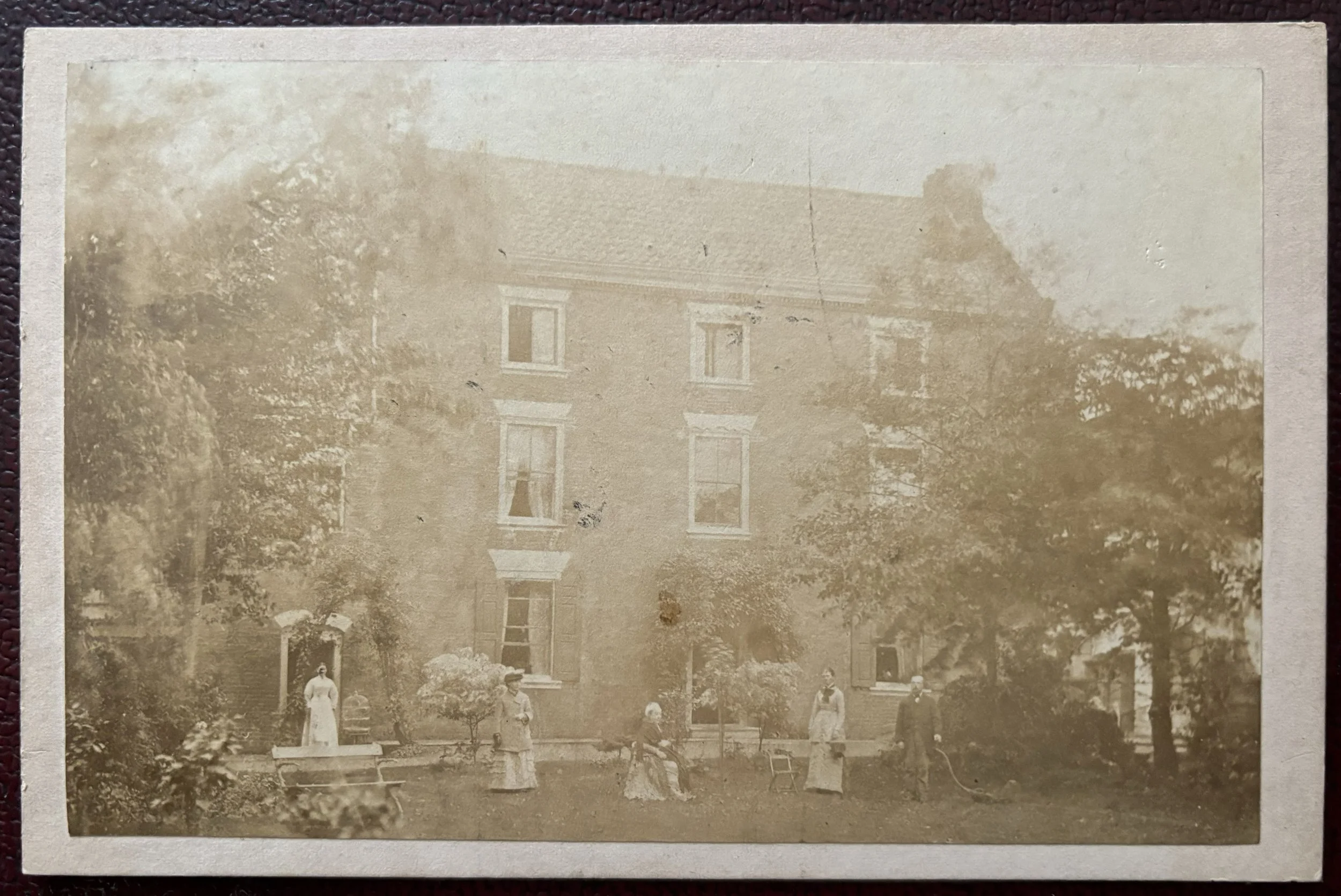 Cabinet card photograph of a house with people stood in front of it by James King, Scarborough and Gainsborough