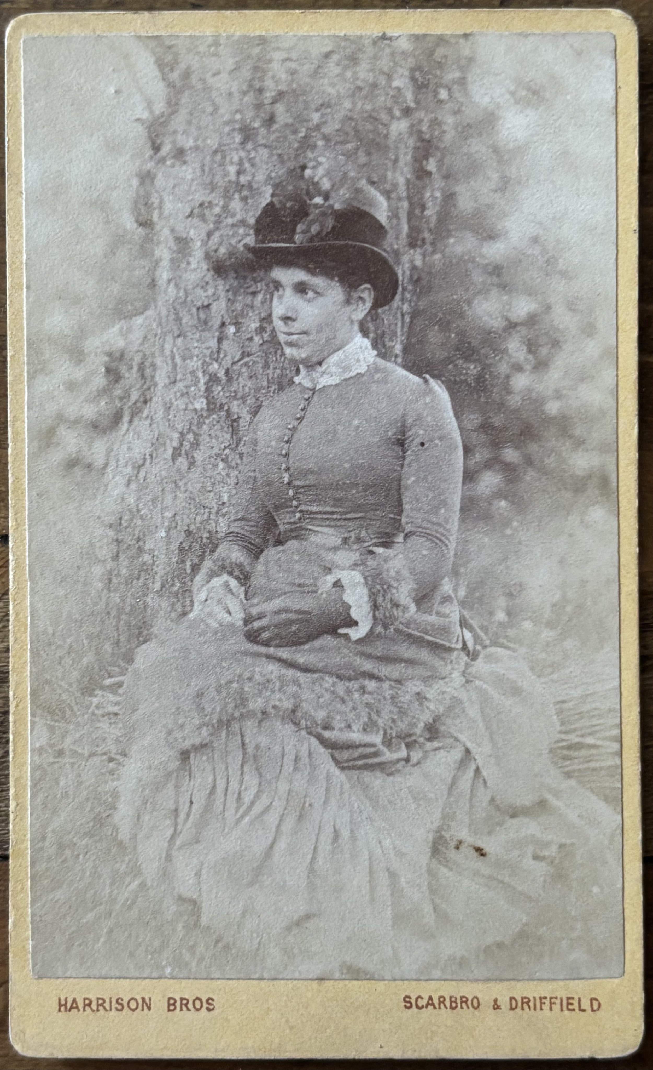 portrait of an unknown woman photographer outside under a tree. by Scarborough and Driffield photographers the Harridon Bros, Brothers