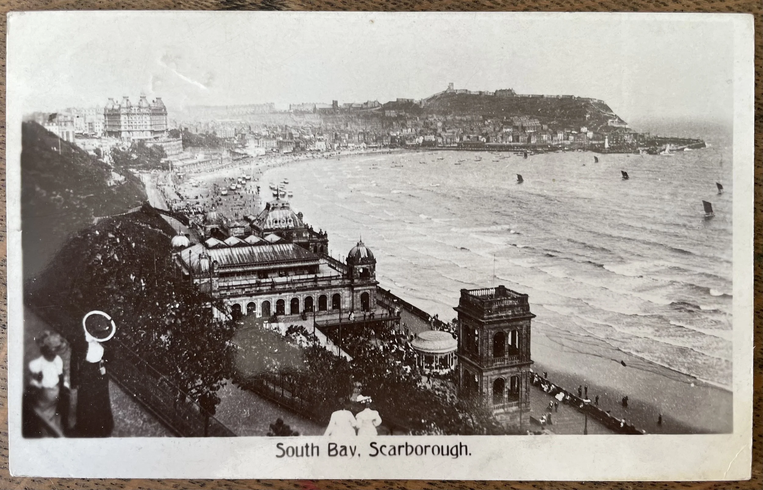 Photographic postcard of South Bay Scarborough, with the Spa in the foreground and the castle in the distance by J. Ashworth and Sons