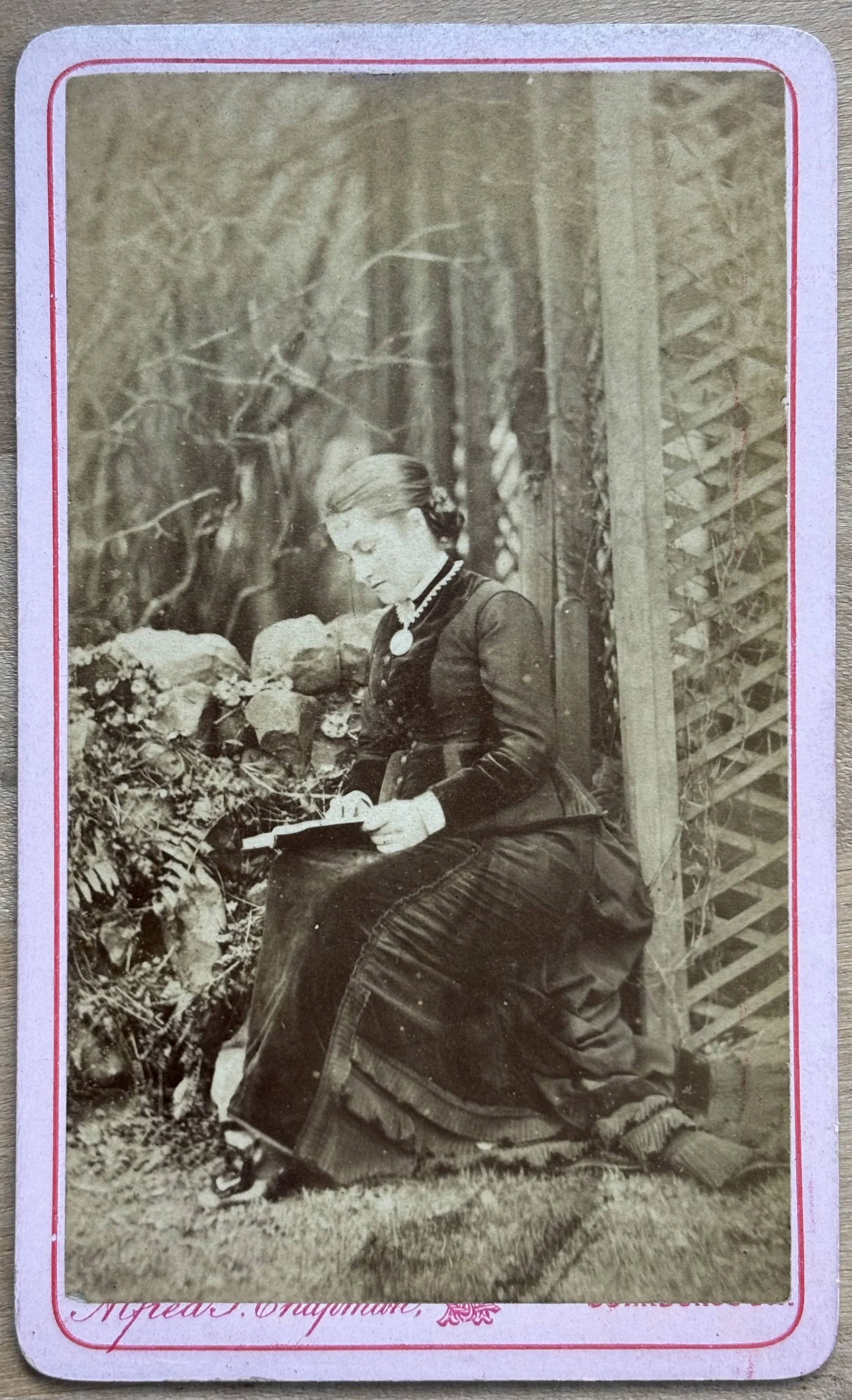 Portrait of a woman sat outside reading, cdv by Alfred Thornton Chapman, Scarborough photographer