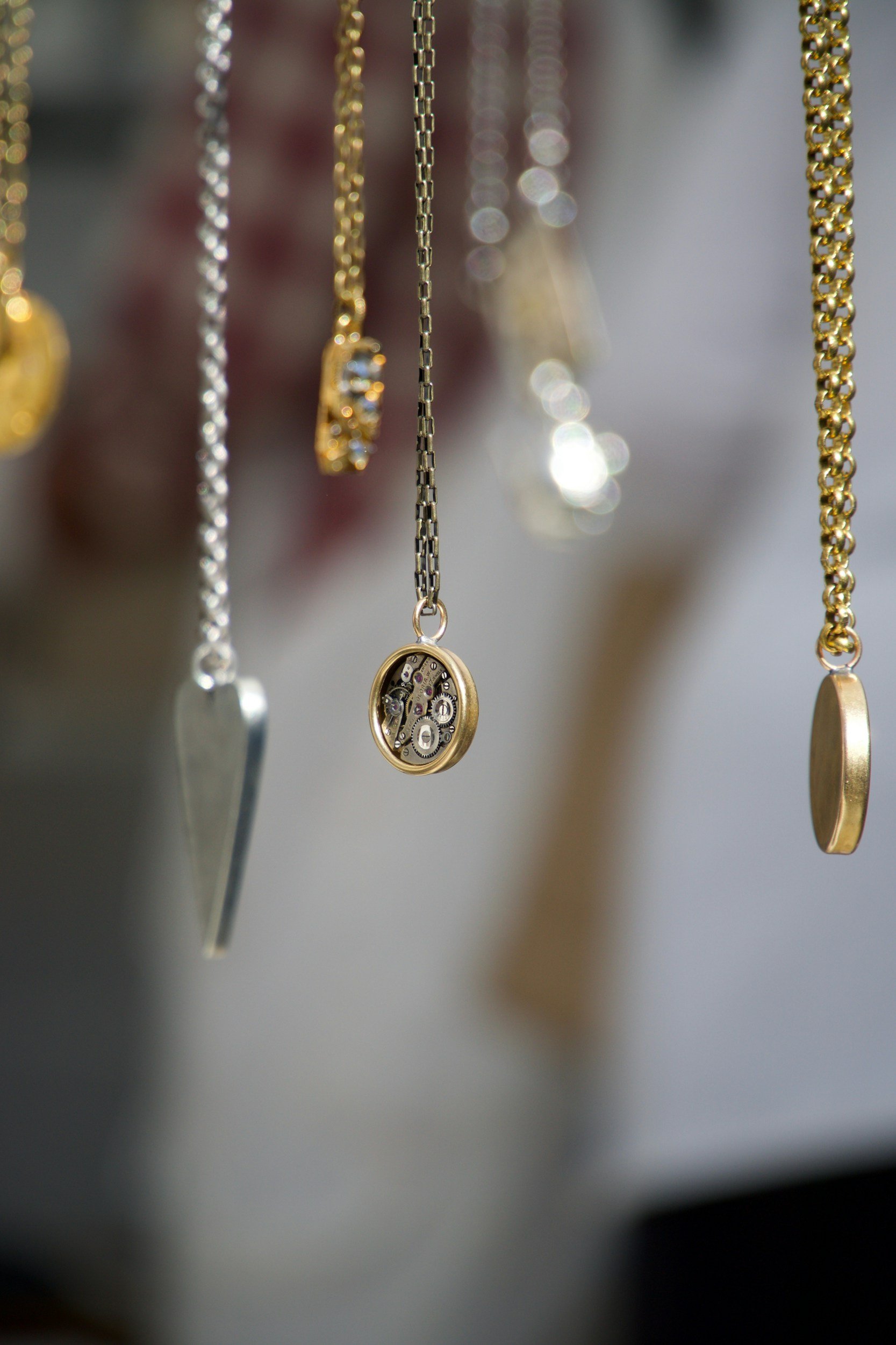 Assorted gold and silver necklaces displayed together