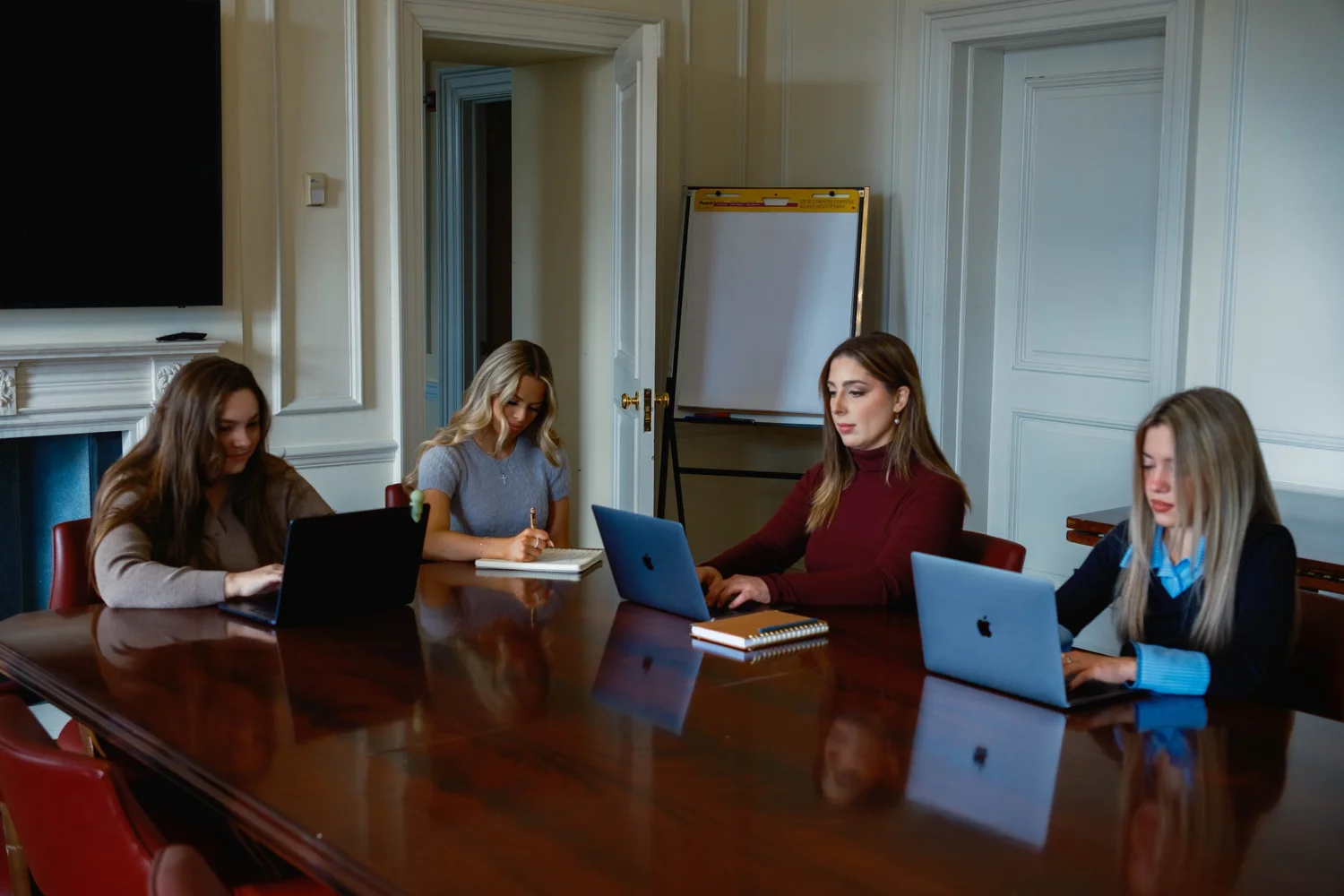 Reinstate Labs colleagues reviewing client work