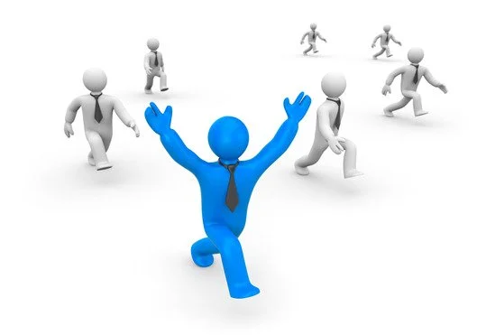 A blue 3D humanoid figure with a tie, kneeling with arms raised, surrounded by gray figures running away.