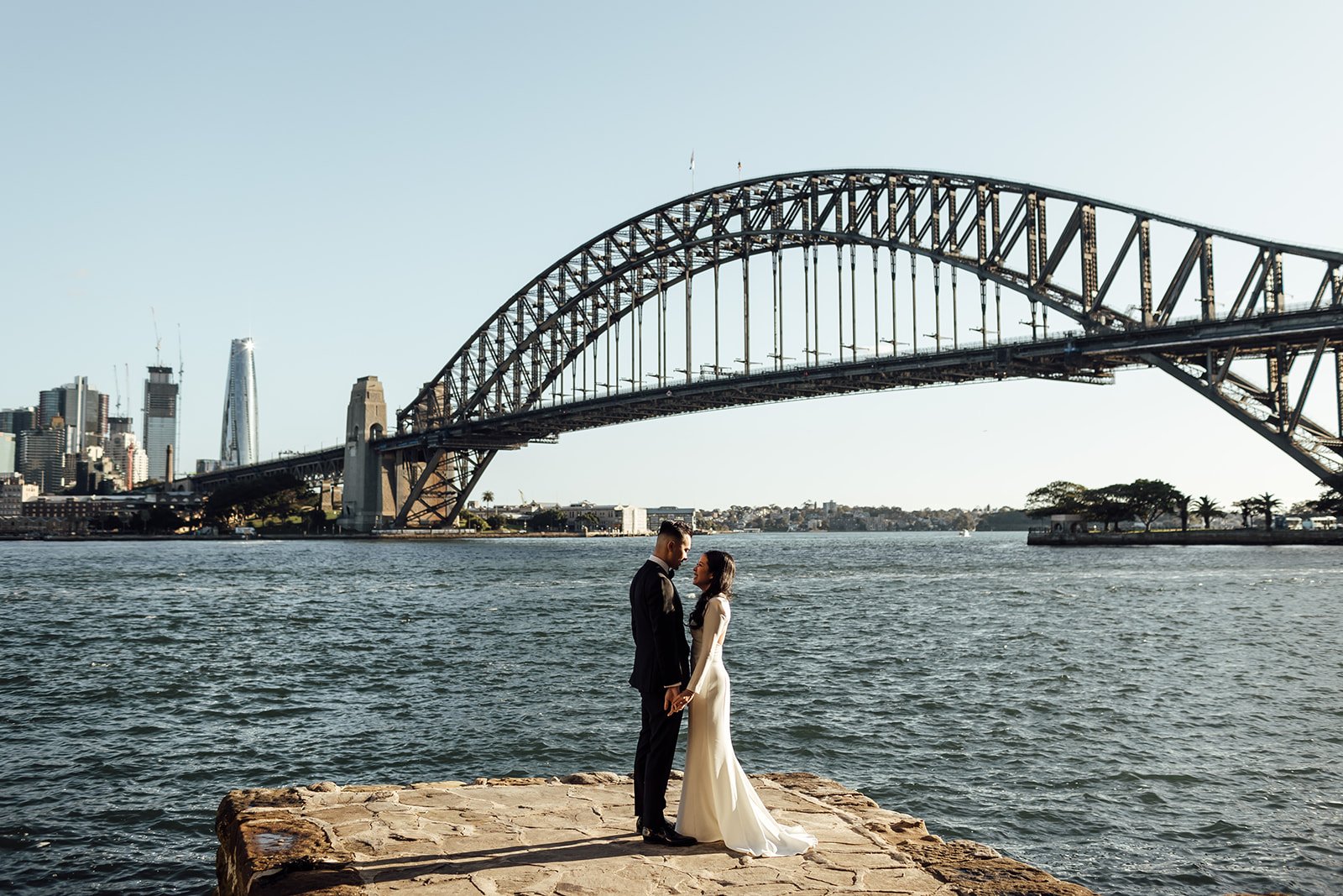 Bride and groom at Lachlan Wilson’s Lookout with the Sydney Harbour Bridge in the background