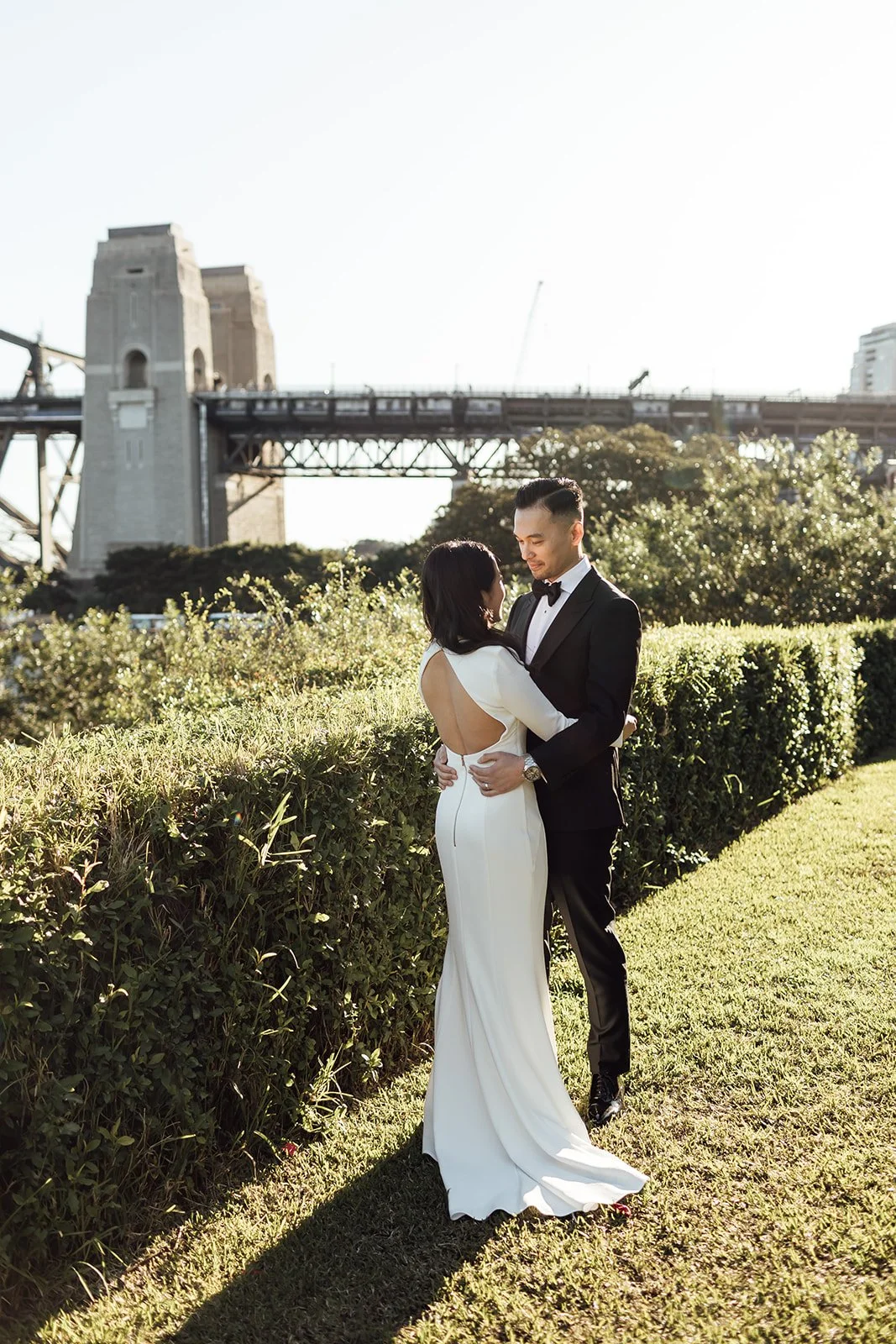 Bride and groom at Mary Booth Reserve with the Sydney Harbour Bridge in the background