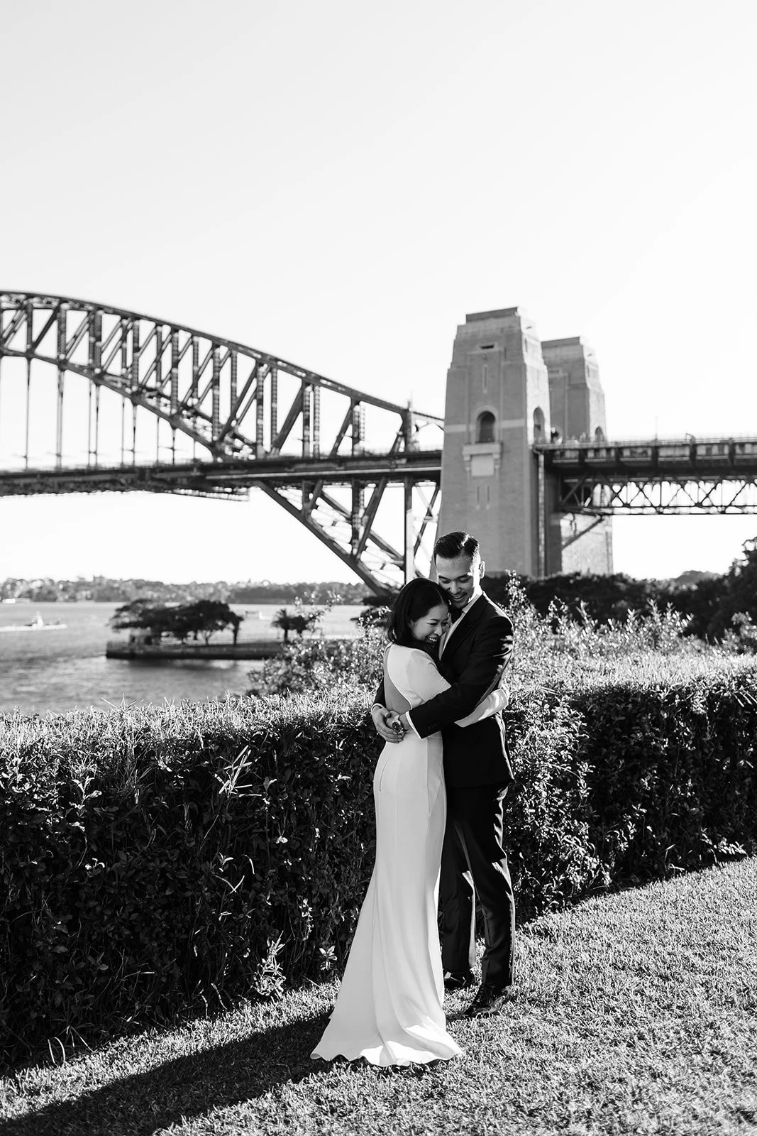 Bride and groom at Mary Booth Reserve with the Sydney Harbour Bridge in the background