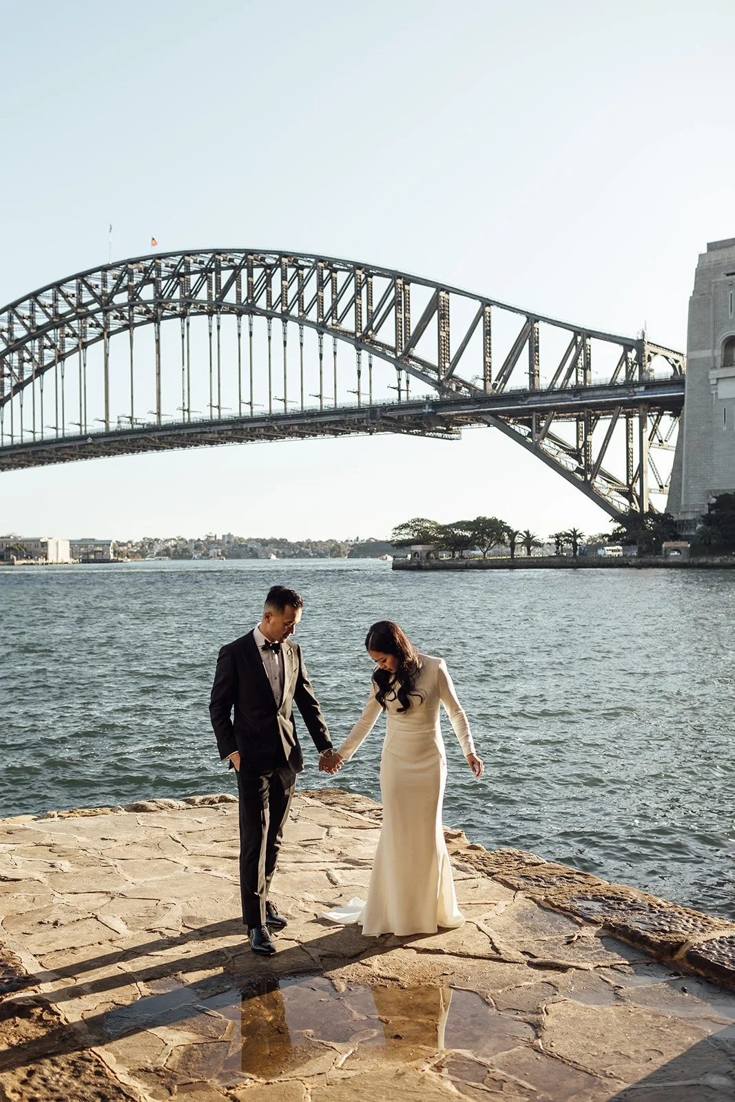 Bride and groom at Lachlan Wilson’s Lookout with the Sydney Harbour Bridge in the background