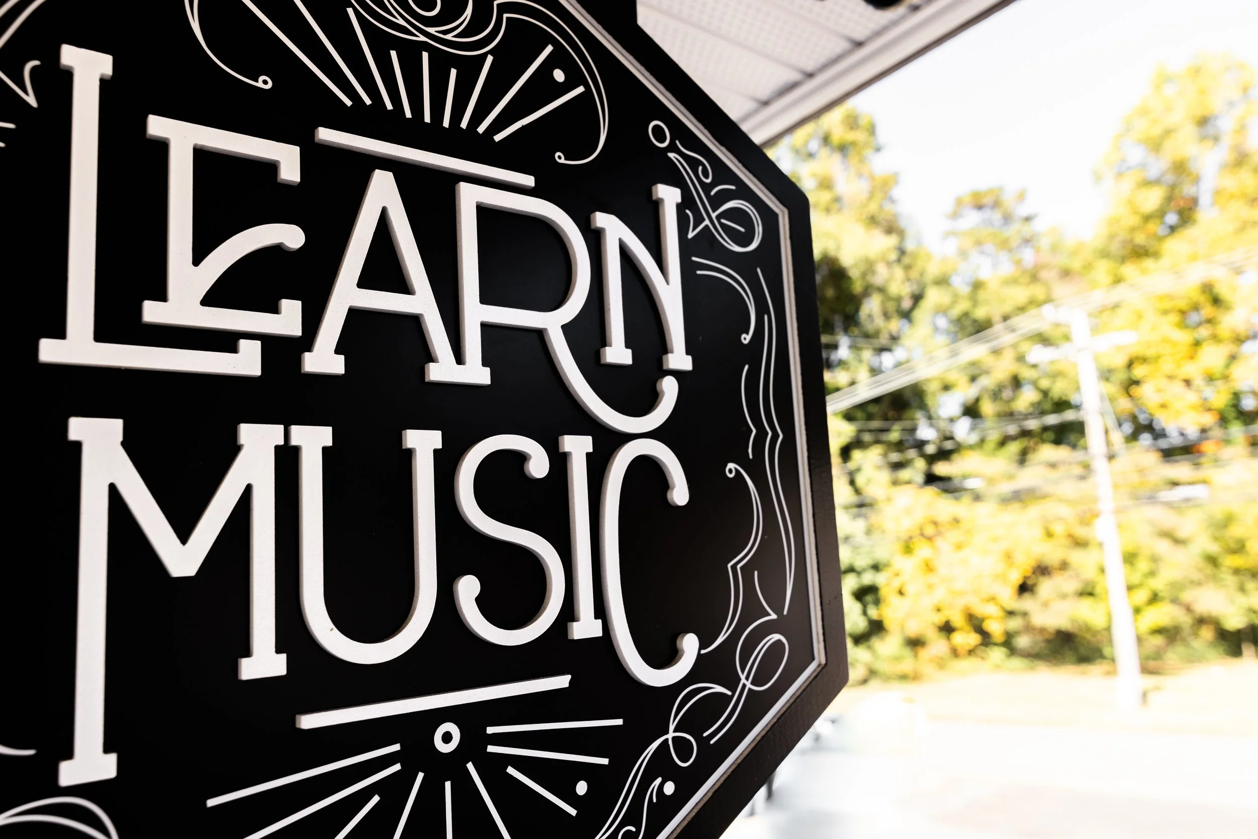 The black and white learn music sign outside in Cornelius, NC