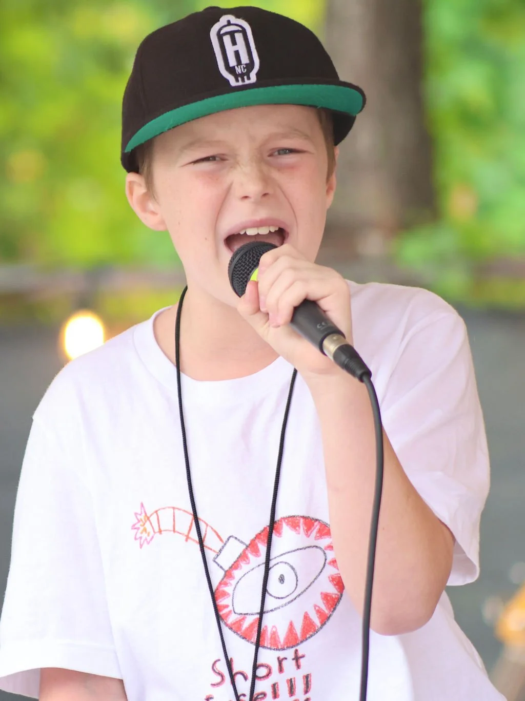 Student performing at a Learn Music Legends Block Party in Huntersville, NC
