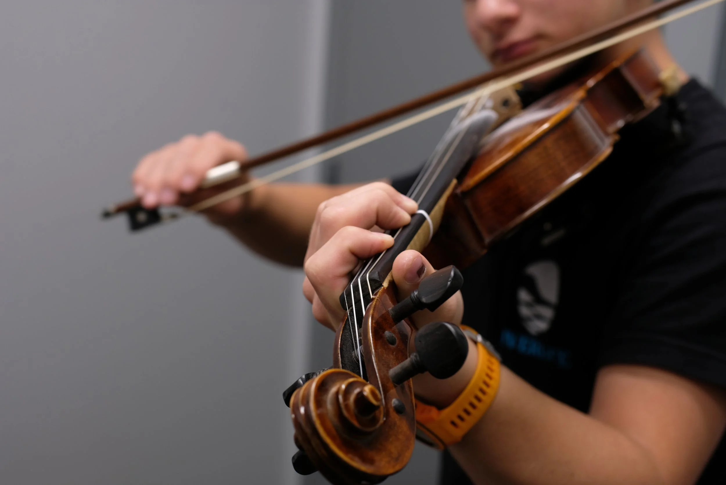 Student playing violin during a private lesson in Cornelius, NC
