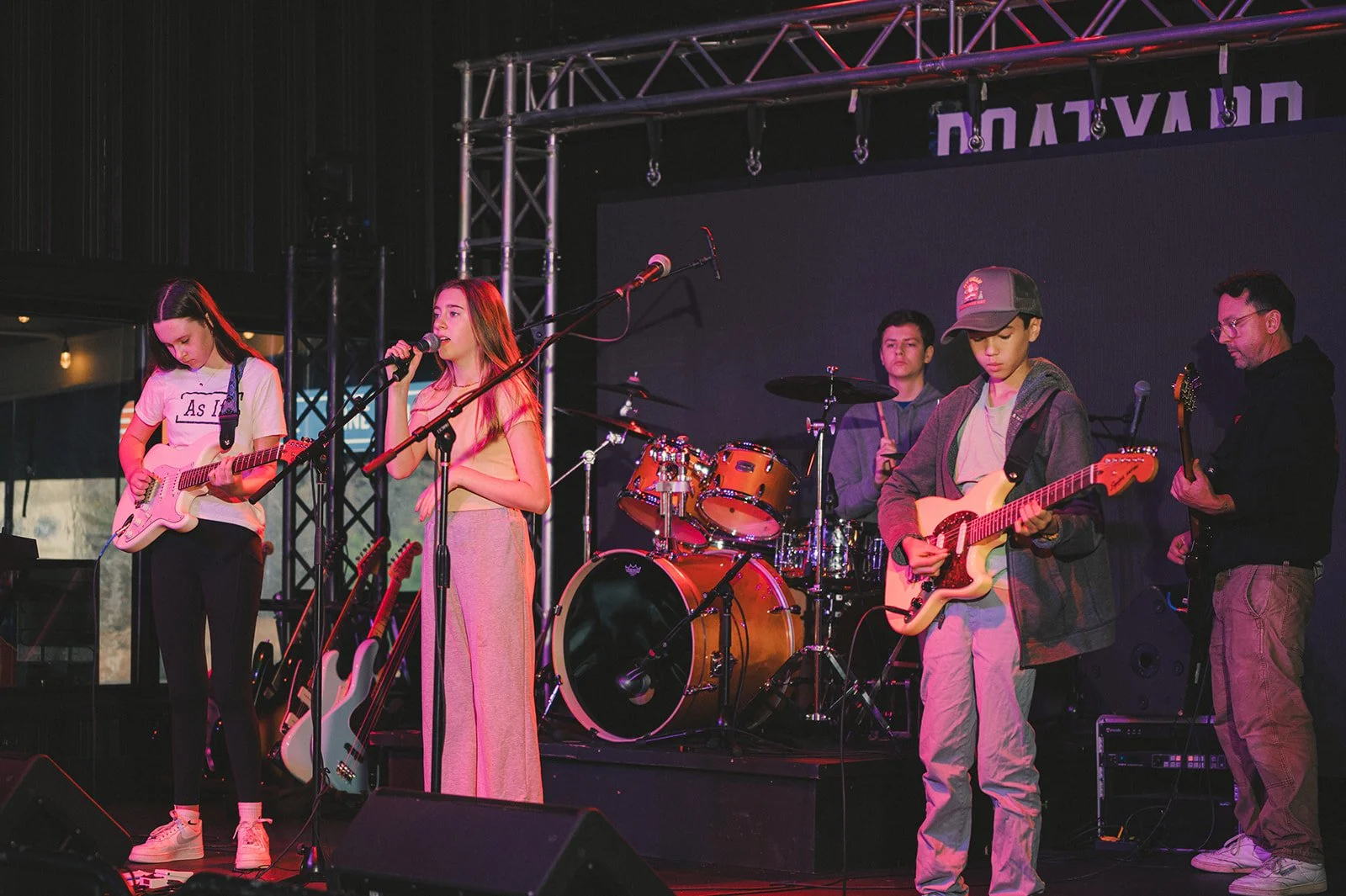 High school students performing together in a student rock band near Huntersville, NC