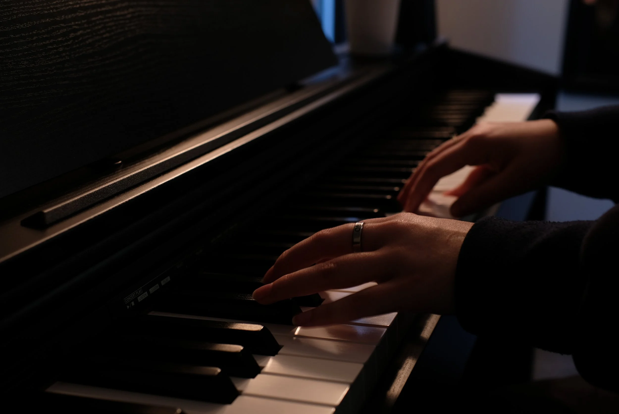 Student playing piano during a private lesson in Cornelius, NC