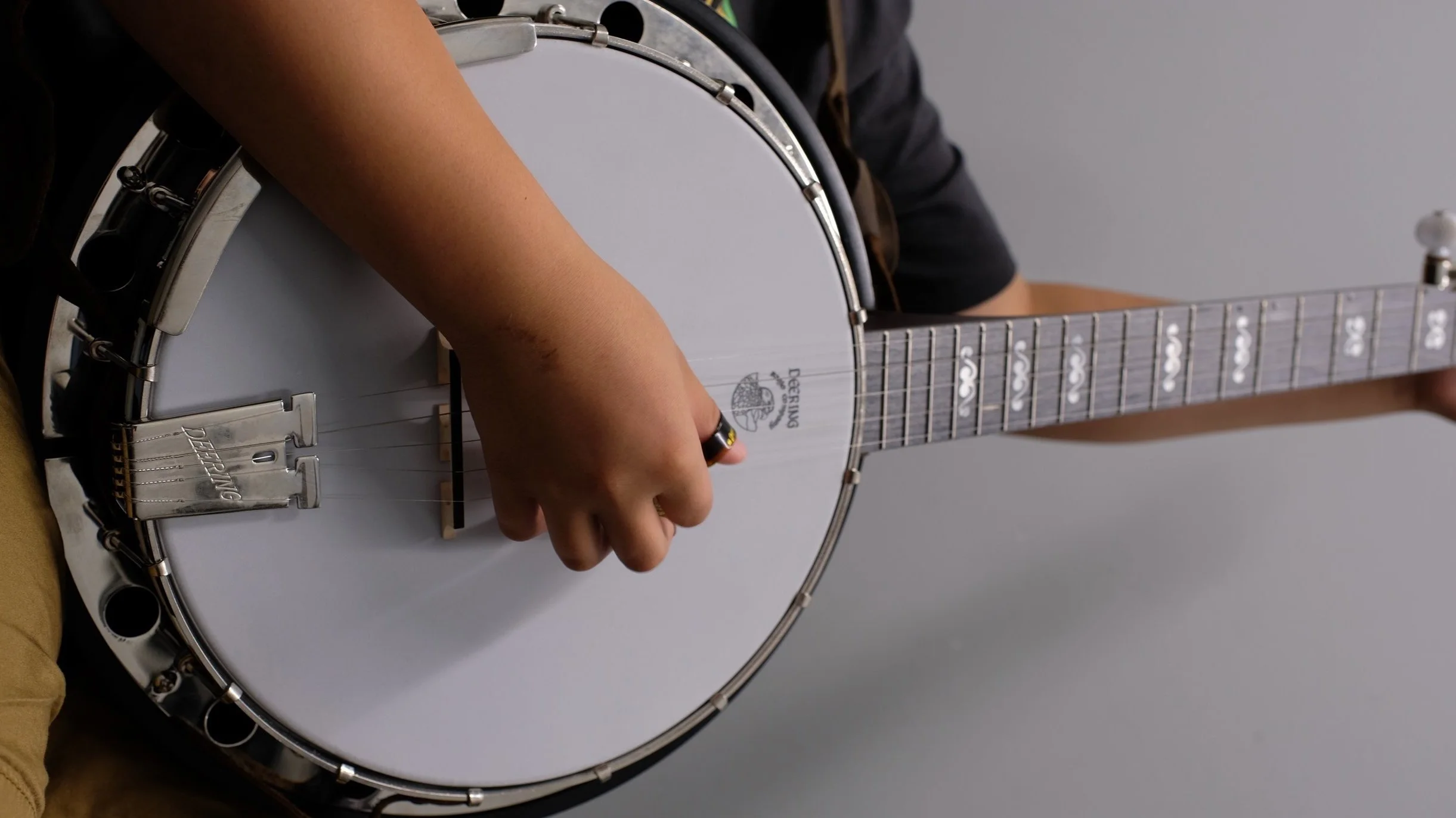 Student playing banjo during a private lesson in the Lake Norman, NC area
