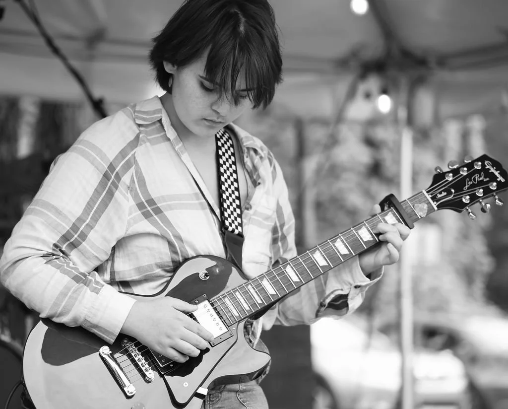 Student guitarist performing with a Legends rock band near Mooresville, NC