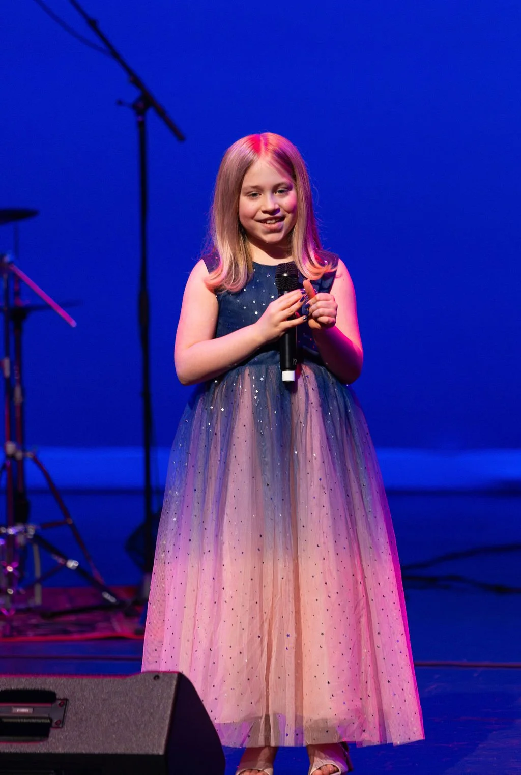 Student singing at a Learn Music Live recital in Cornelius, NC