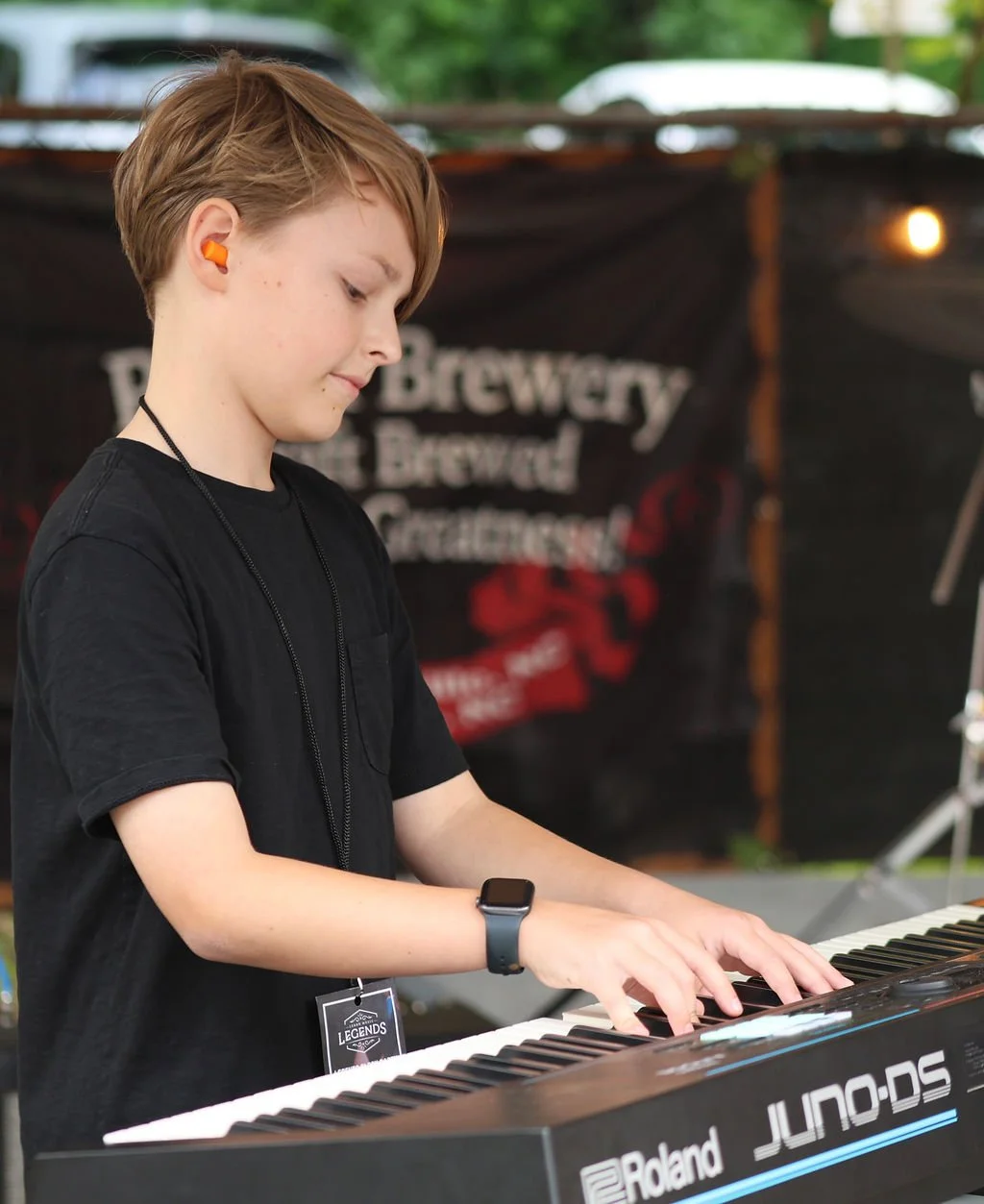 Student pianist performing with a Legends rock band near Davidson, NC