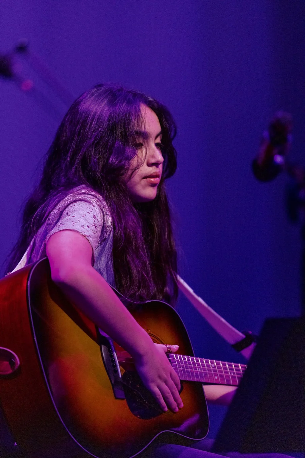 Guitar student performing at a Learn Music Live recital in Cornelius, NC