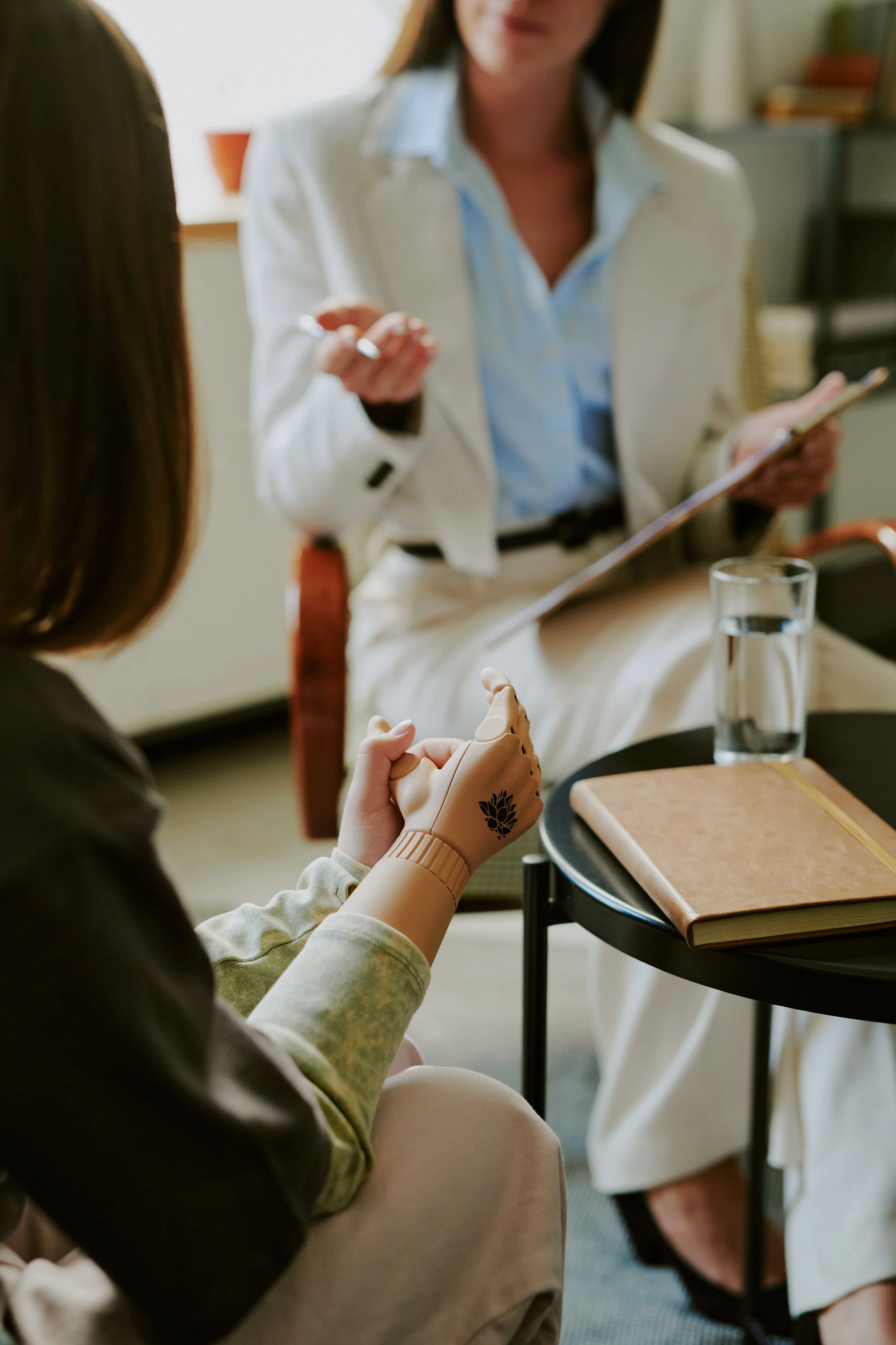 Clinician and patient discussing ADHD symptoms and treatment planning in an office