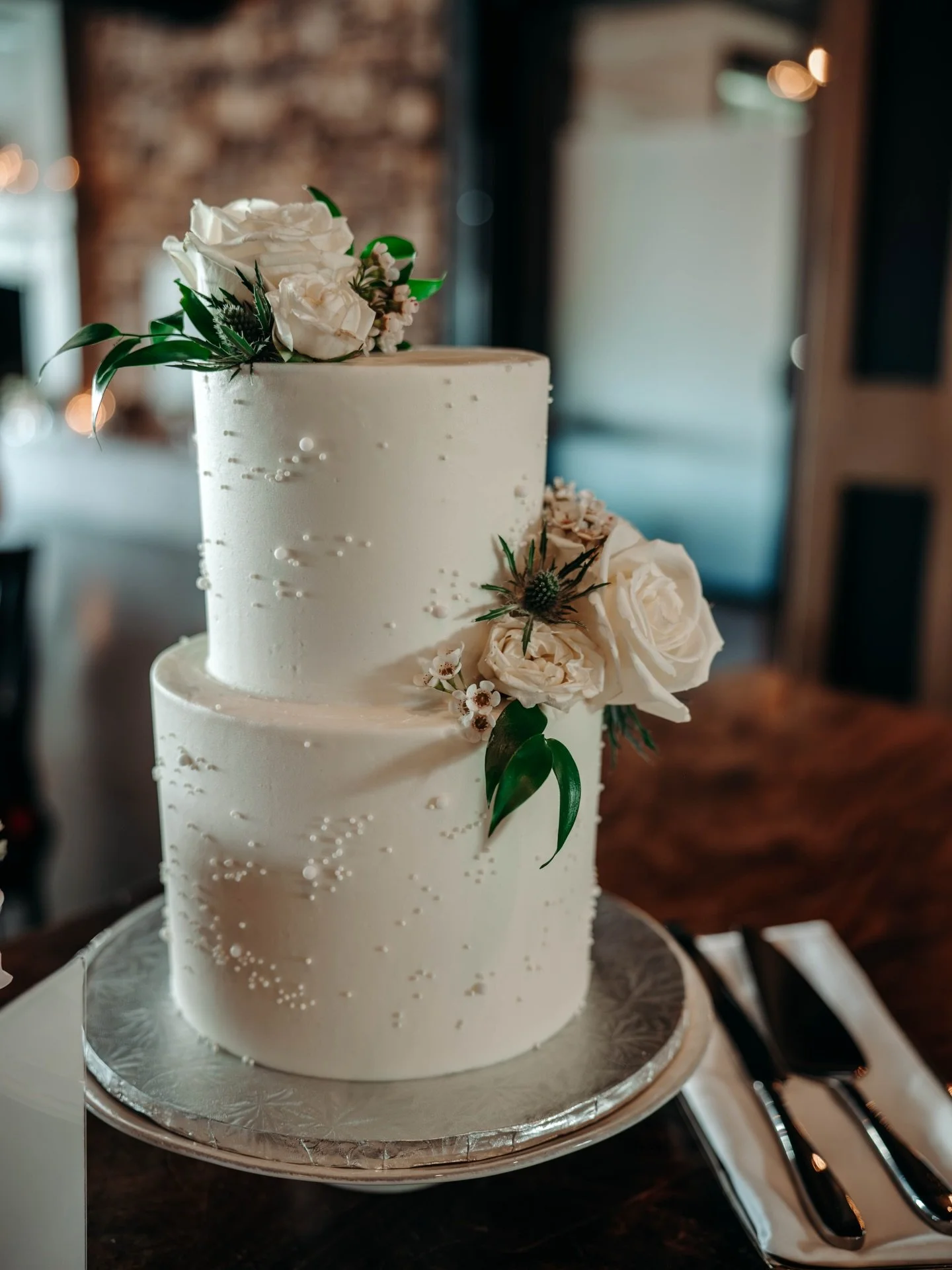 First official act as husband and wife: destroying evidence of a very pretty cake. 
#yycweddings #CalgaryWeddingPhotography #calgaryweddingphotographer