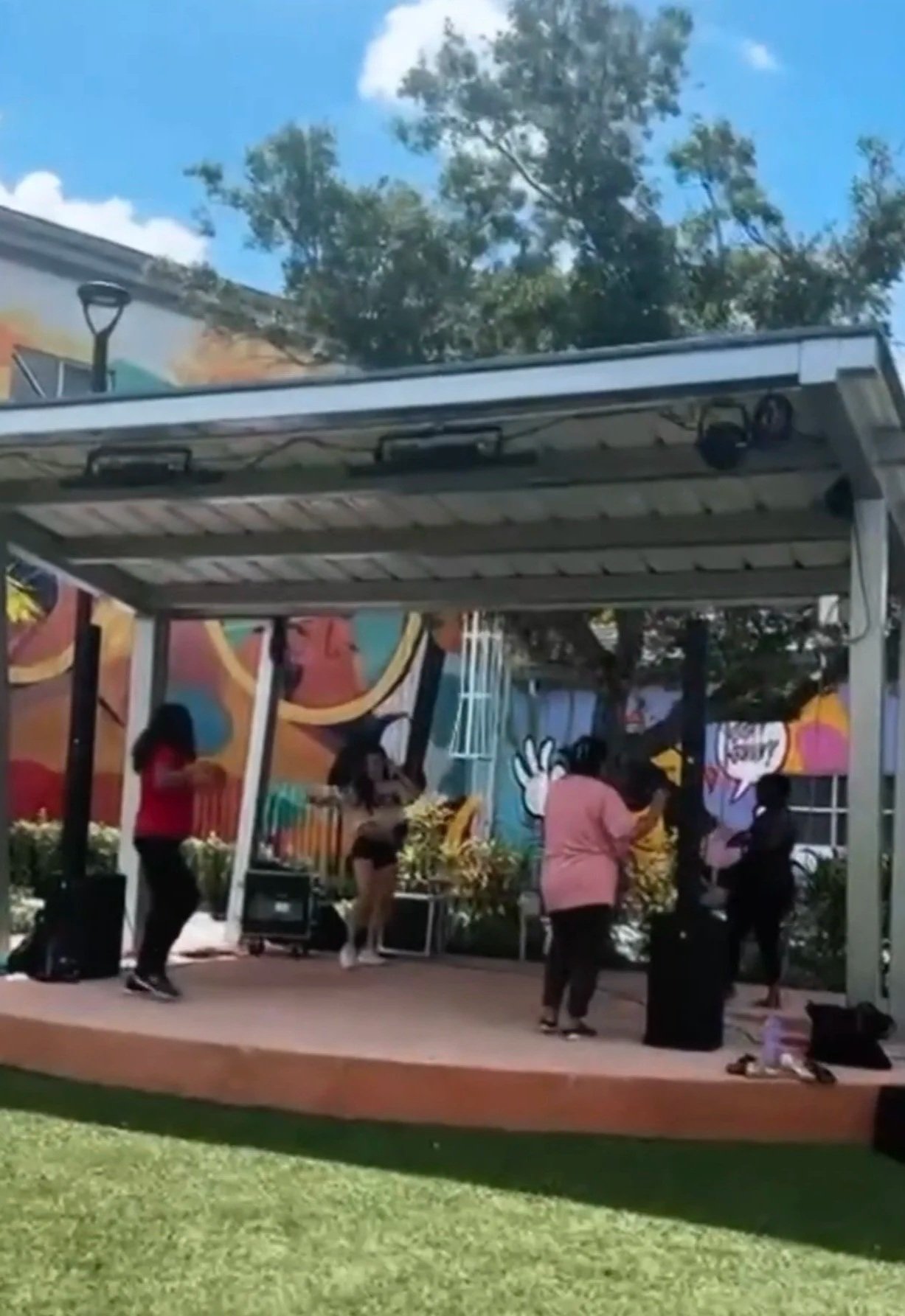 Belly Heat guests dancing under a covered pavilion at a private group event