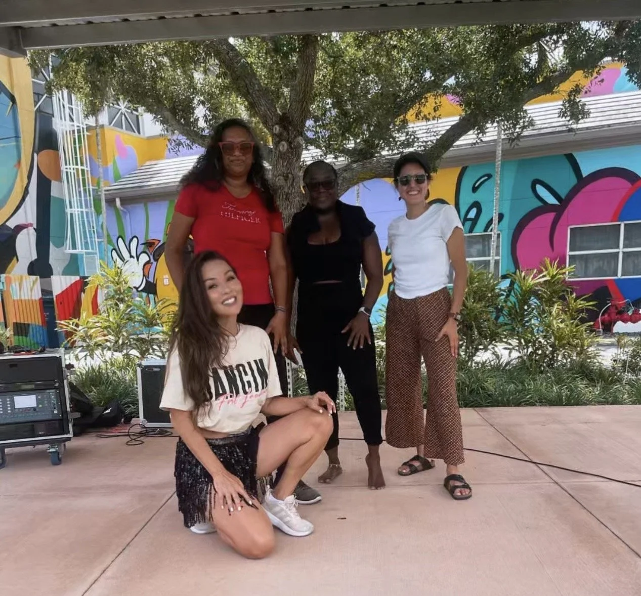 Belly Heat group photo of four women smiling together after a private dance fitness event in Fort Lauderdale