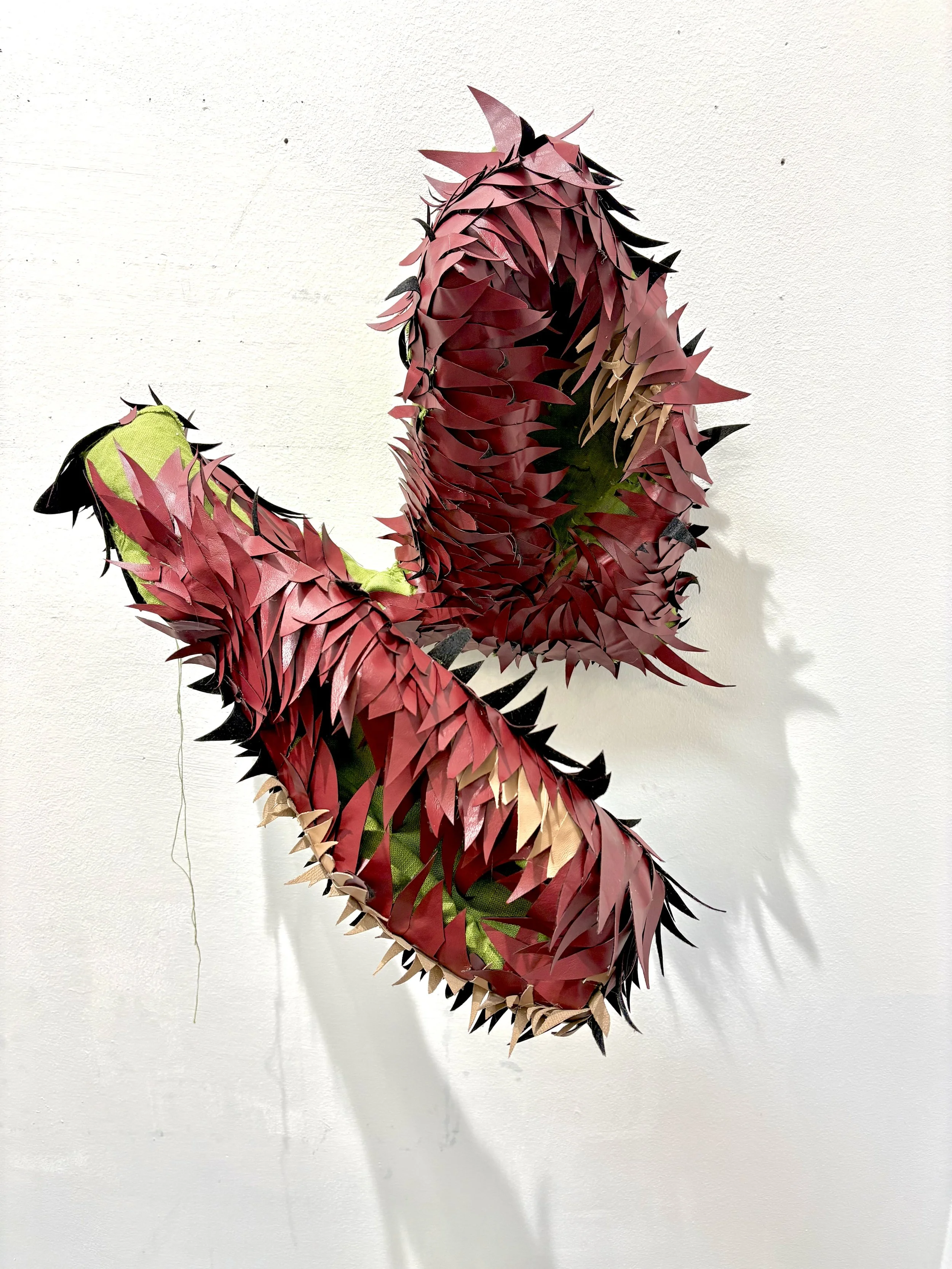 A secret she hides, 27x27x24 in., vinyl, linen, wire, thread, 2026