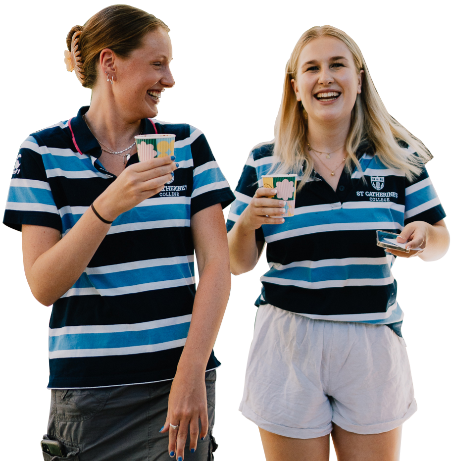 Two people wearing the St Catherine's College polo shirt