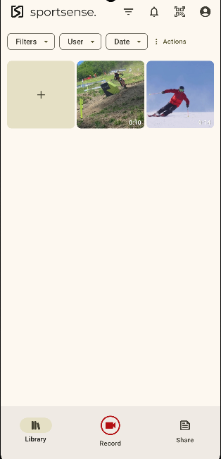 The library with the Filters, User and Date menus and a ski clip added from the camera roll