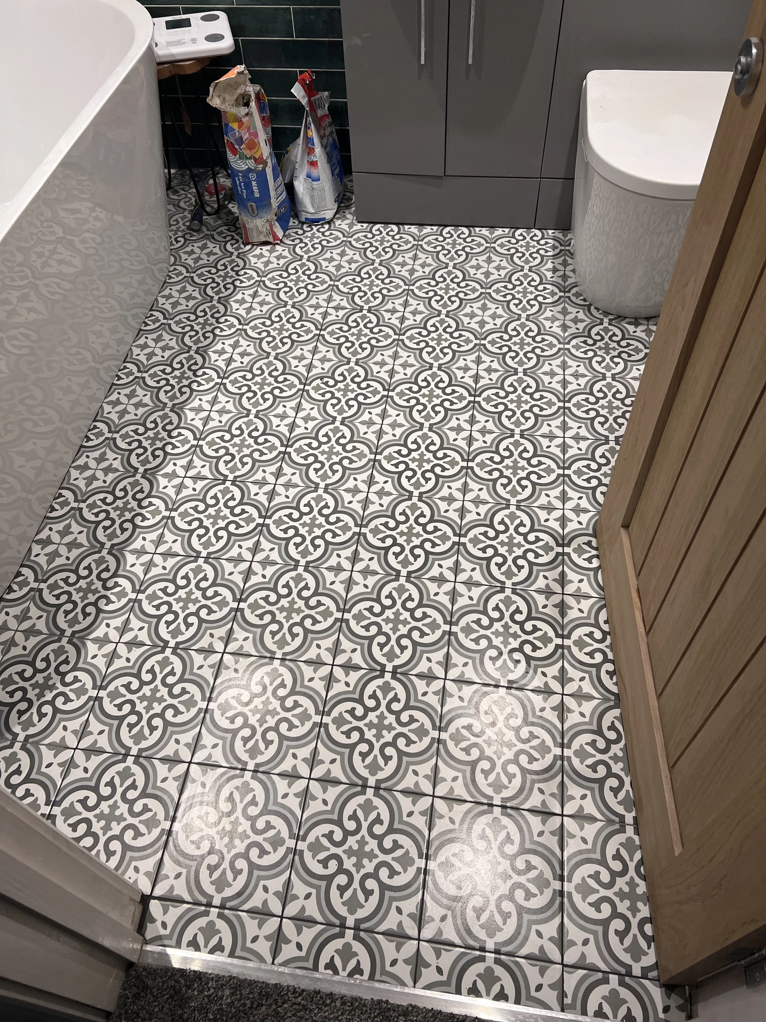 Floor re-tiled after last contractor didn't install correctly and tiles started to come up.