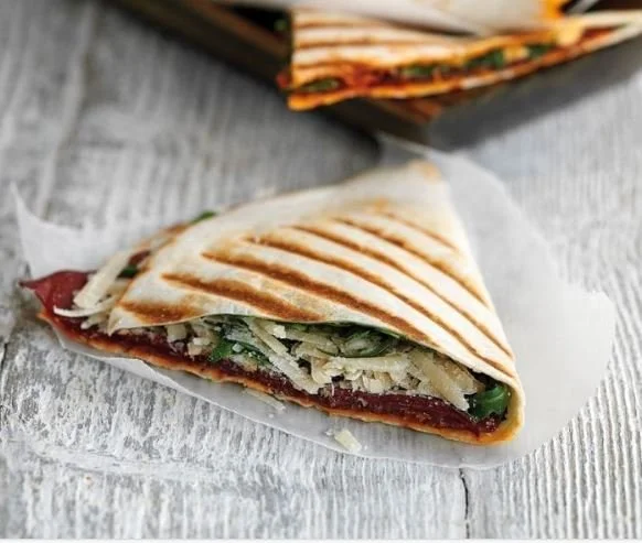 Folded flatbread filled with Wagyu bresaola, rocket and cheese