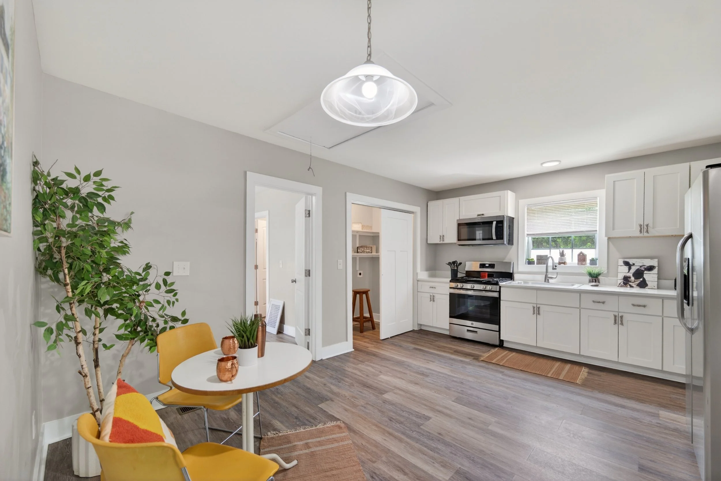 Eat-in Kitchen with updated cabinets, stone counter tops, nice large sink, and updated appliances