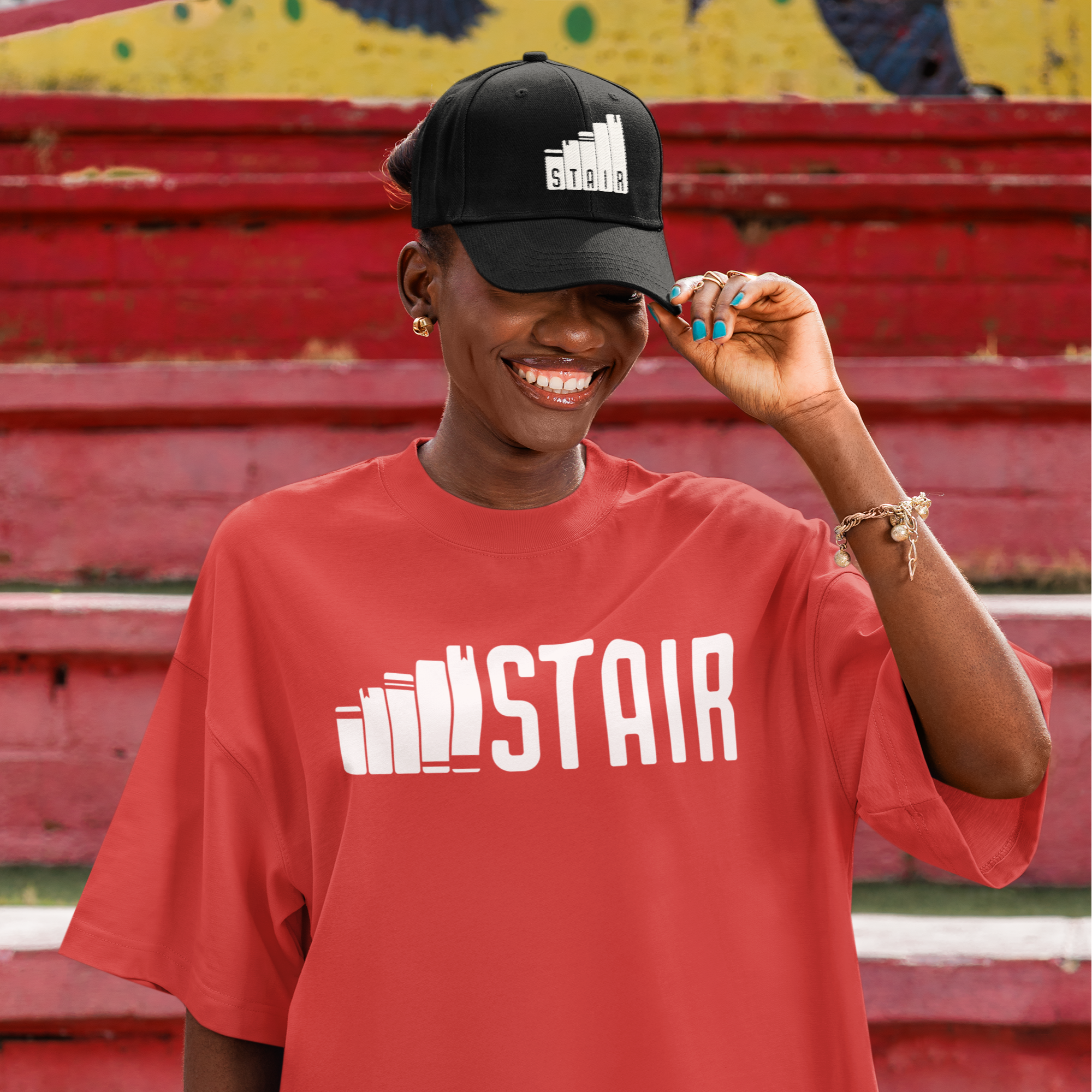 dad-hat-mockup-of-a-cheerful-woman-posing-in-the-street-while-wearing-an-oversized-t-shirt-m56553.png