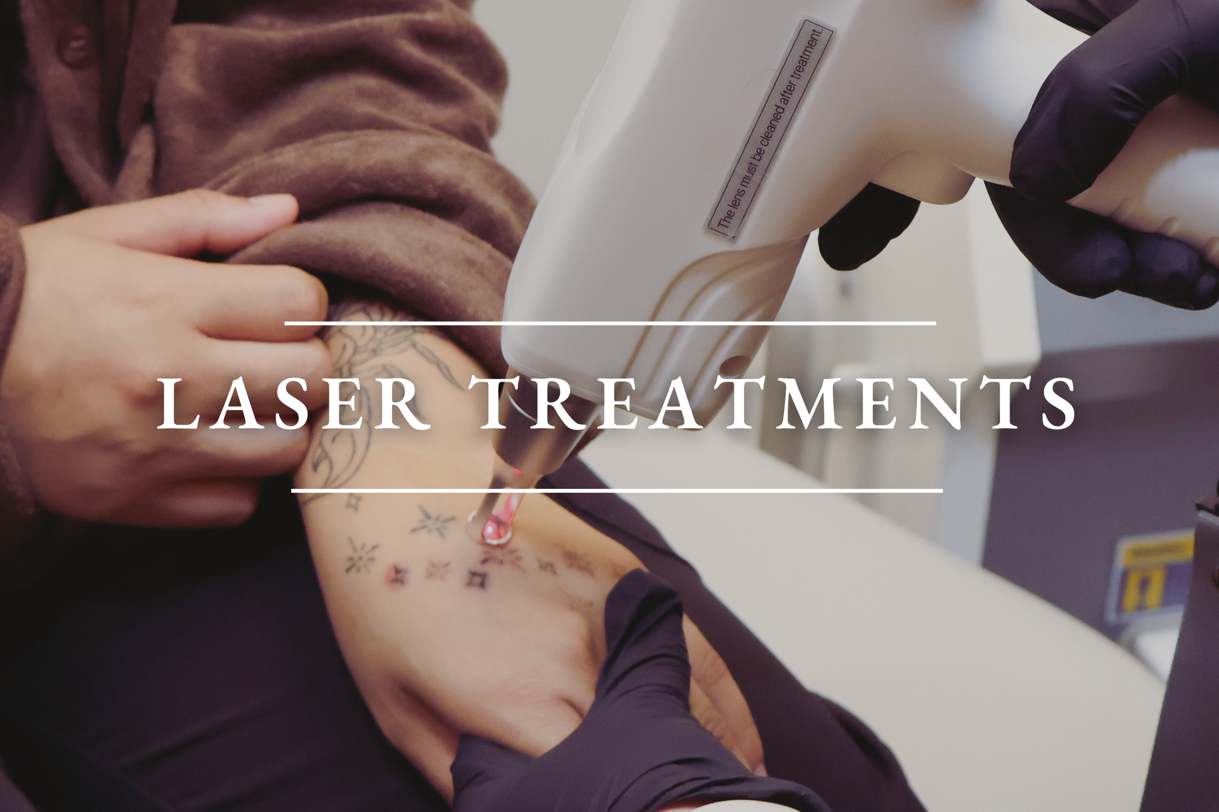 Black and white photo of a person lying on the floor, wearing light-colored underwear, with visible torso, legs, and hand with rings.