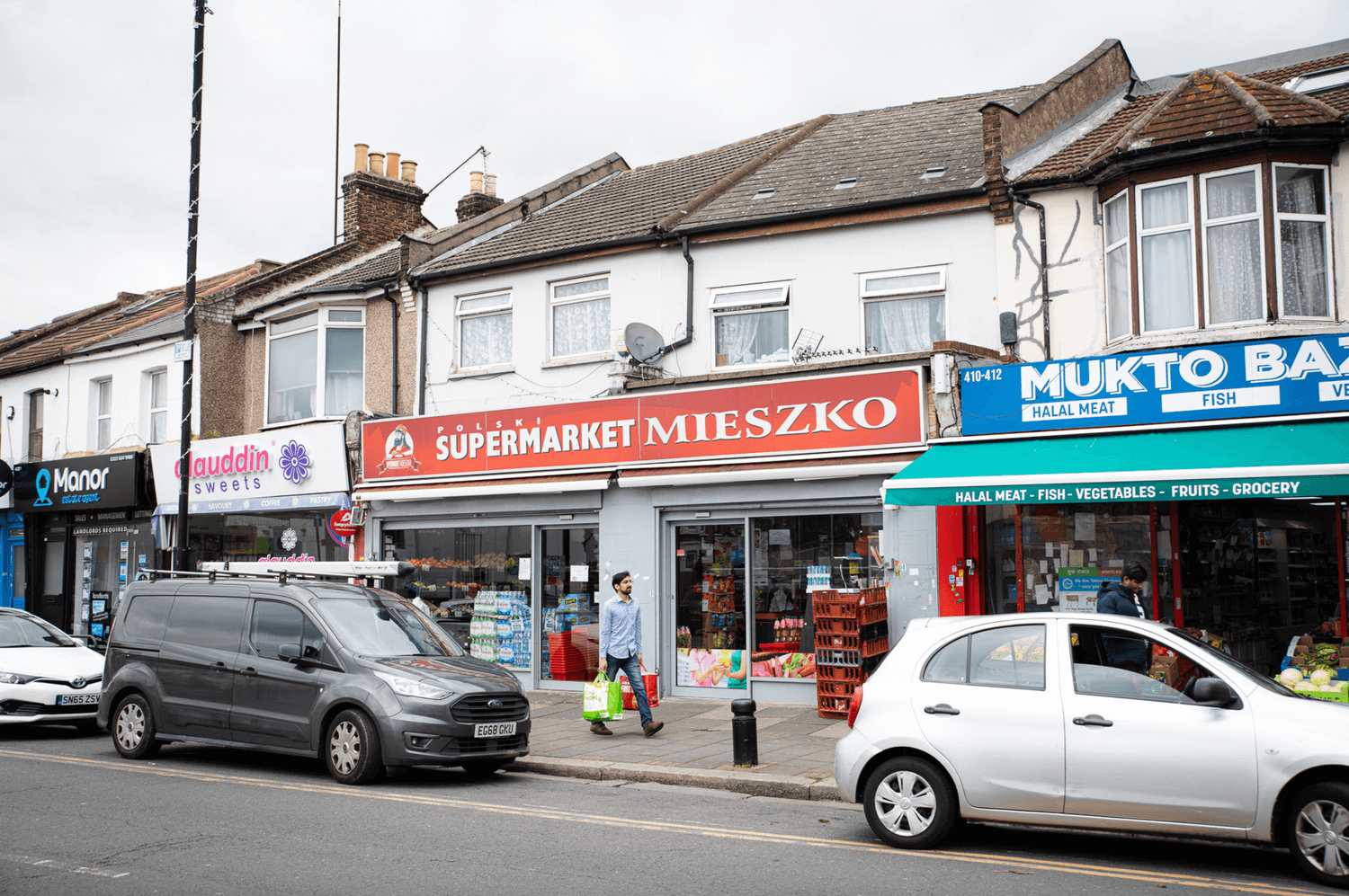 A row of shops with in the middle the Polish supermarket Miekszko.