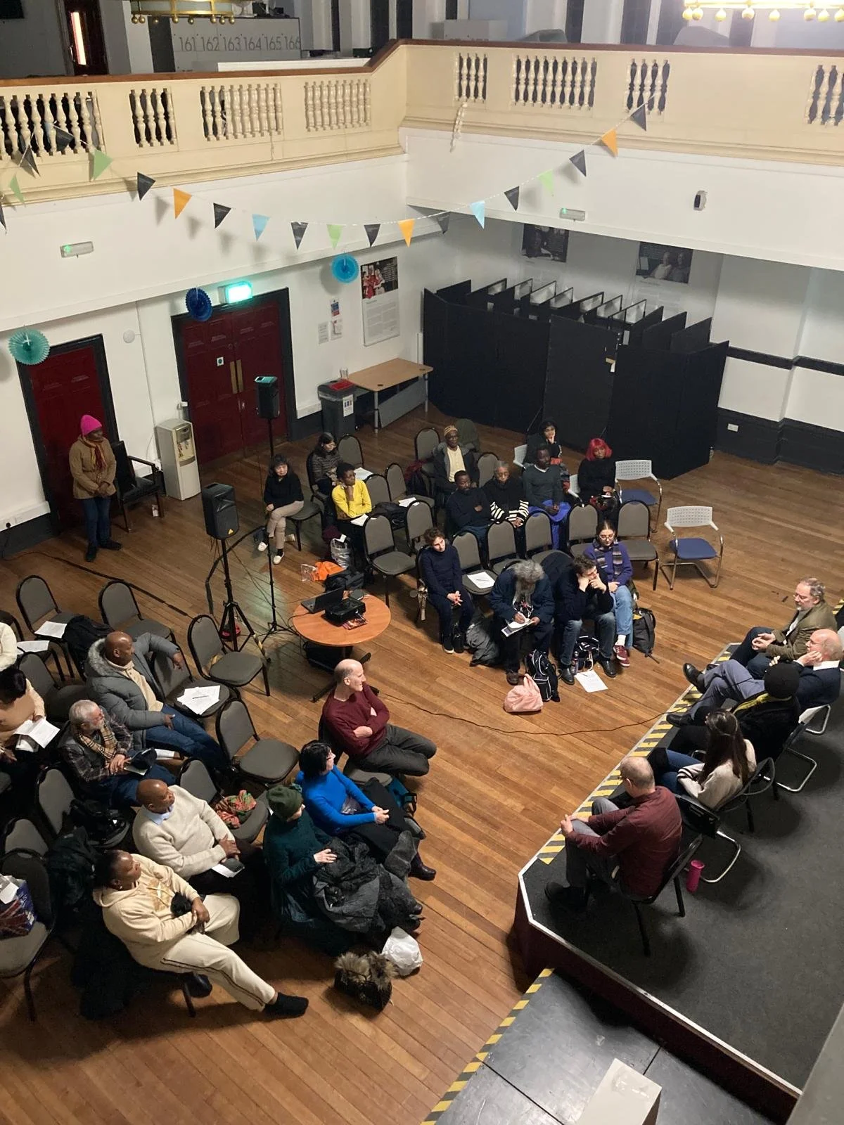 A group of residents are at Community Links for a film screening