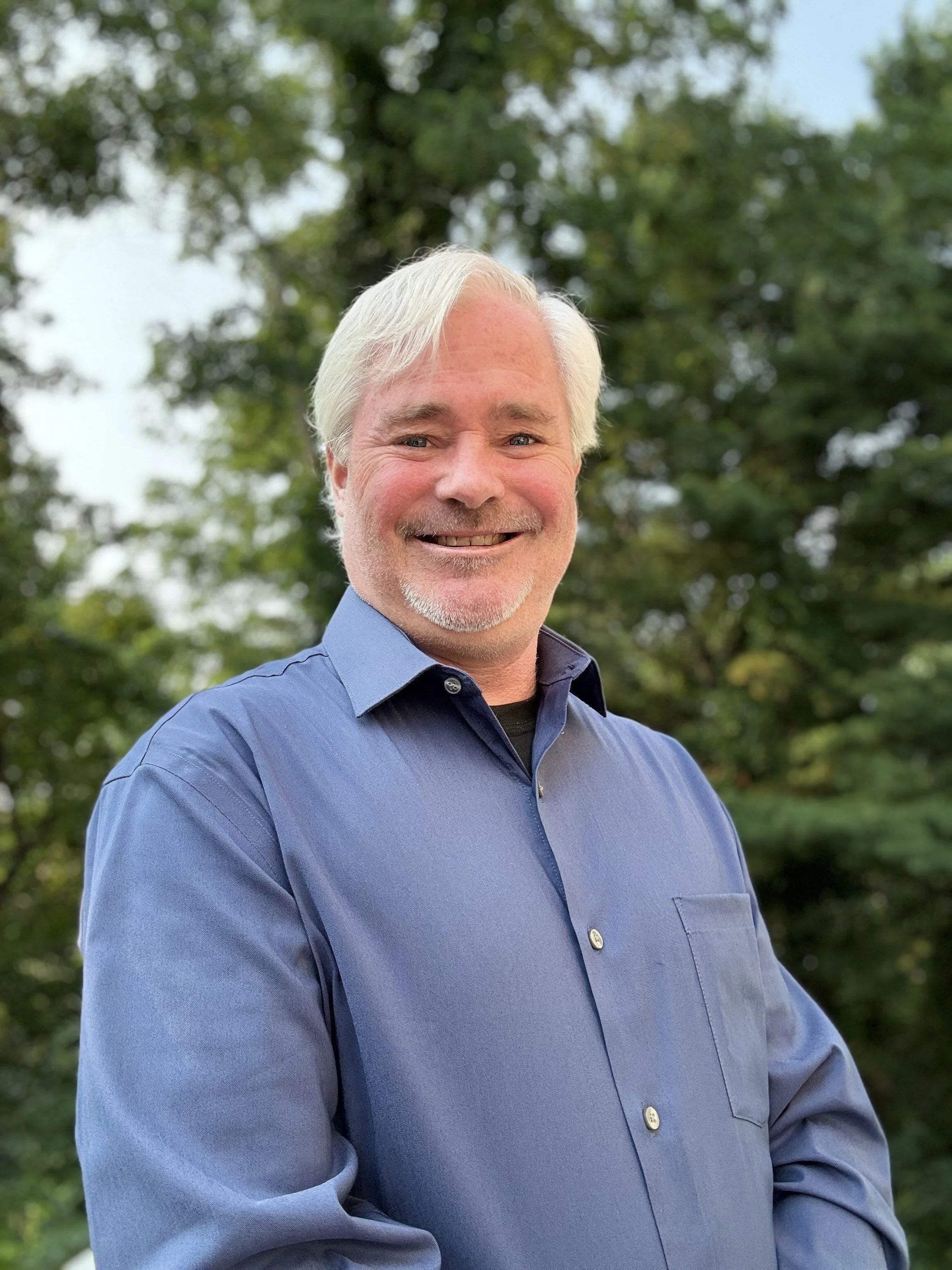 Paul Adams of Your Digital Vault is outdoors posting for a profile photo, and The Death Network