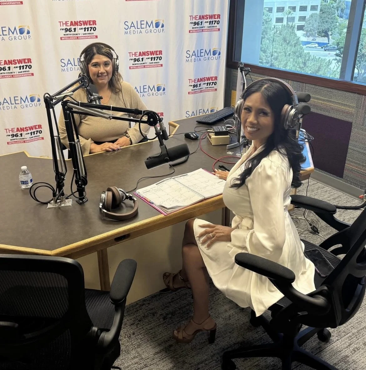 Iris and Thesa prepare to host their KPRZ radio show 