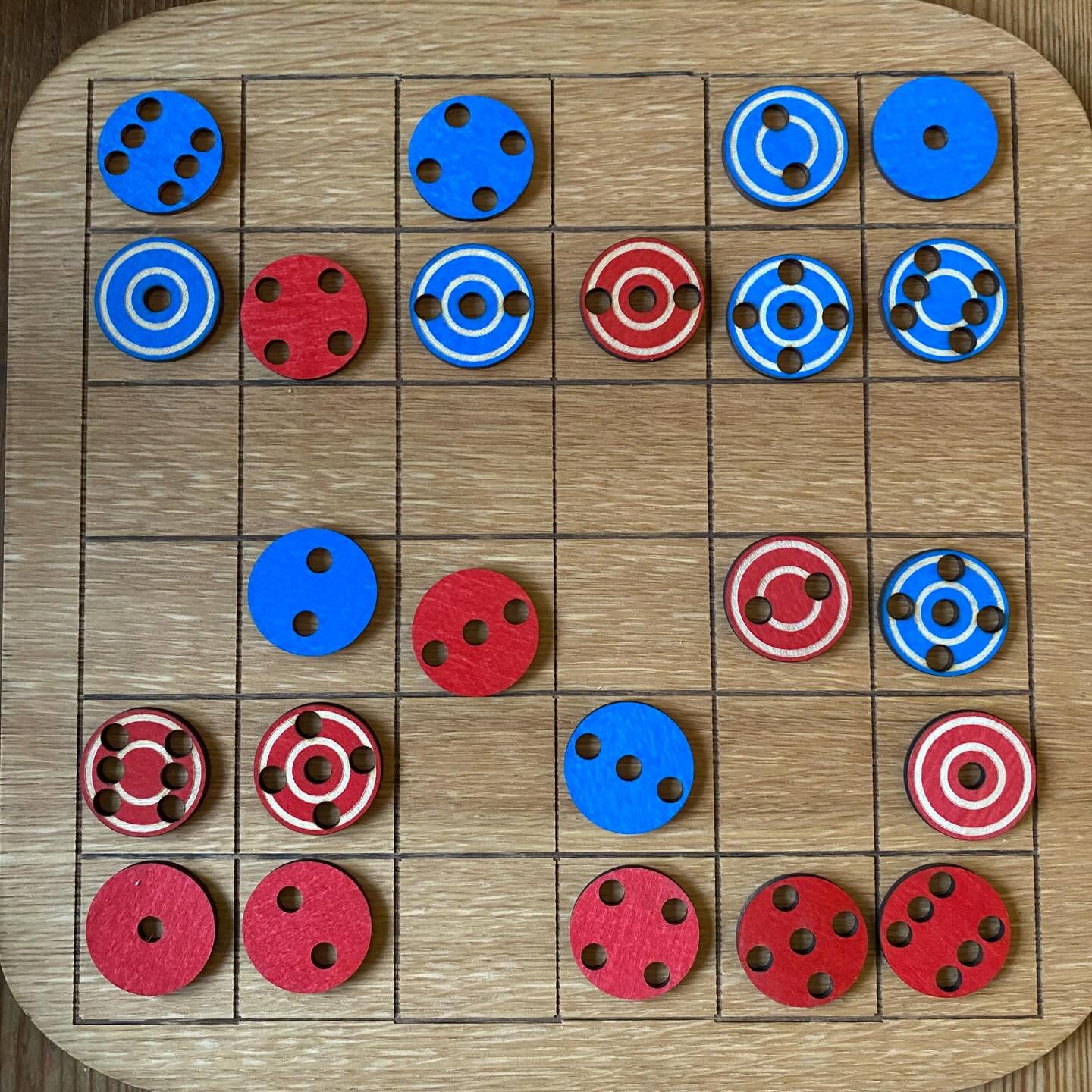 Have you checked out our board game Peruke 84. An evolution of the original game Peruke, safe discs can move across the board like a queen in chess. Points are scored by landing on opponents unsafe discs or by getting one of your own discs to the end