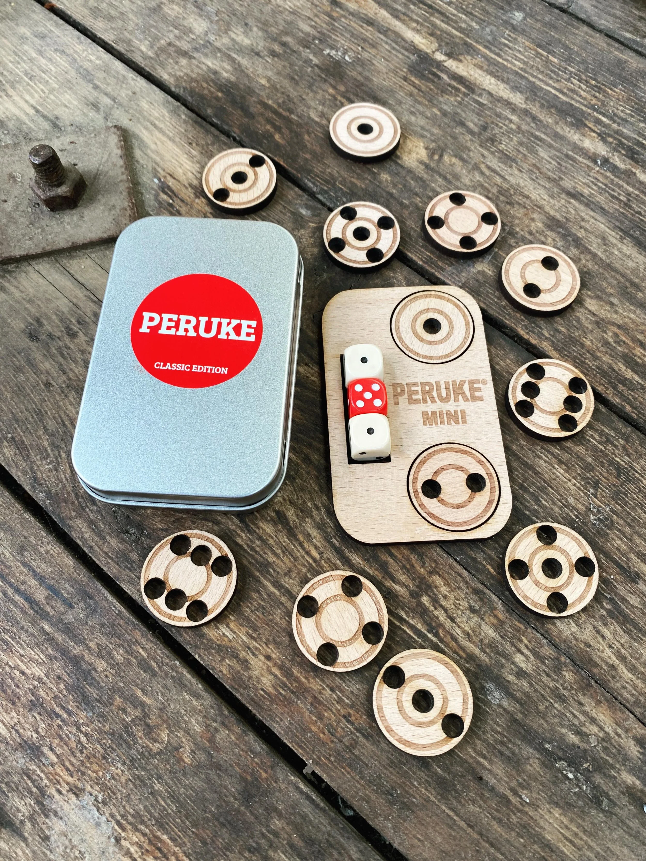 🎲 P E R U K E  M I N I 🎲  Peruke just got even more portable! Our super small Peruke Mini Edition is the perfect companion for all your travels. 24 mini discs (25mm approx) &amp; 3 x 12mm dice all packed perfectly into a mint style tin. This Limite